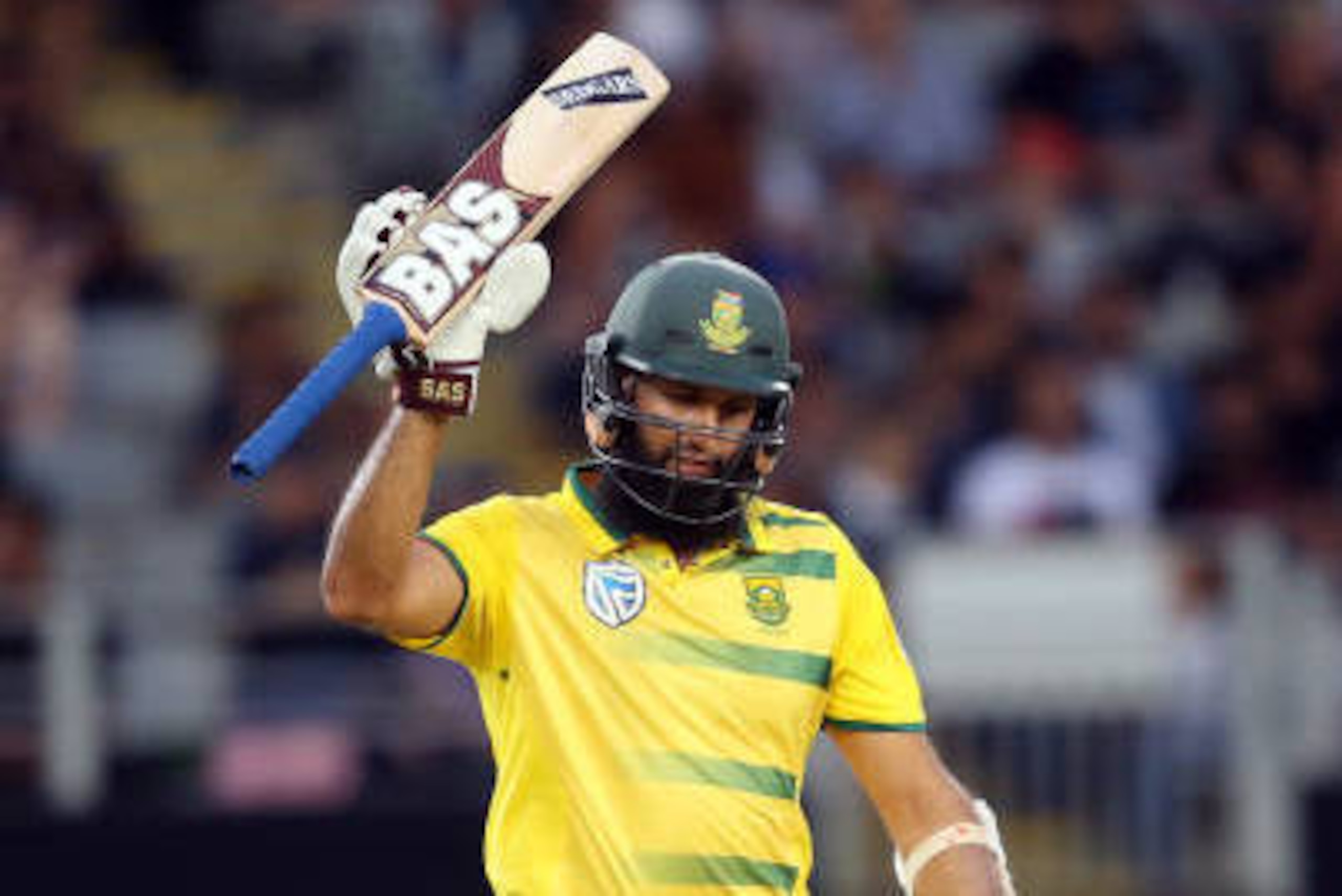 Hashim Amla of South Africa celebrates after reaching his half-century during the Twenty20 international cricket match between New Zealand and South Africa at Eden Park in Auckland on February 17, 2017. / AFP / MICHAEL BRADLEY        (Photo credit should 