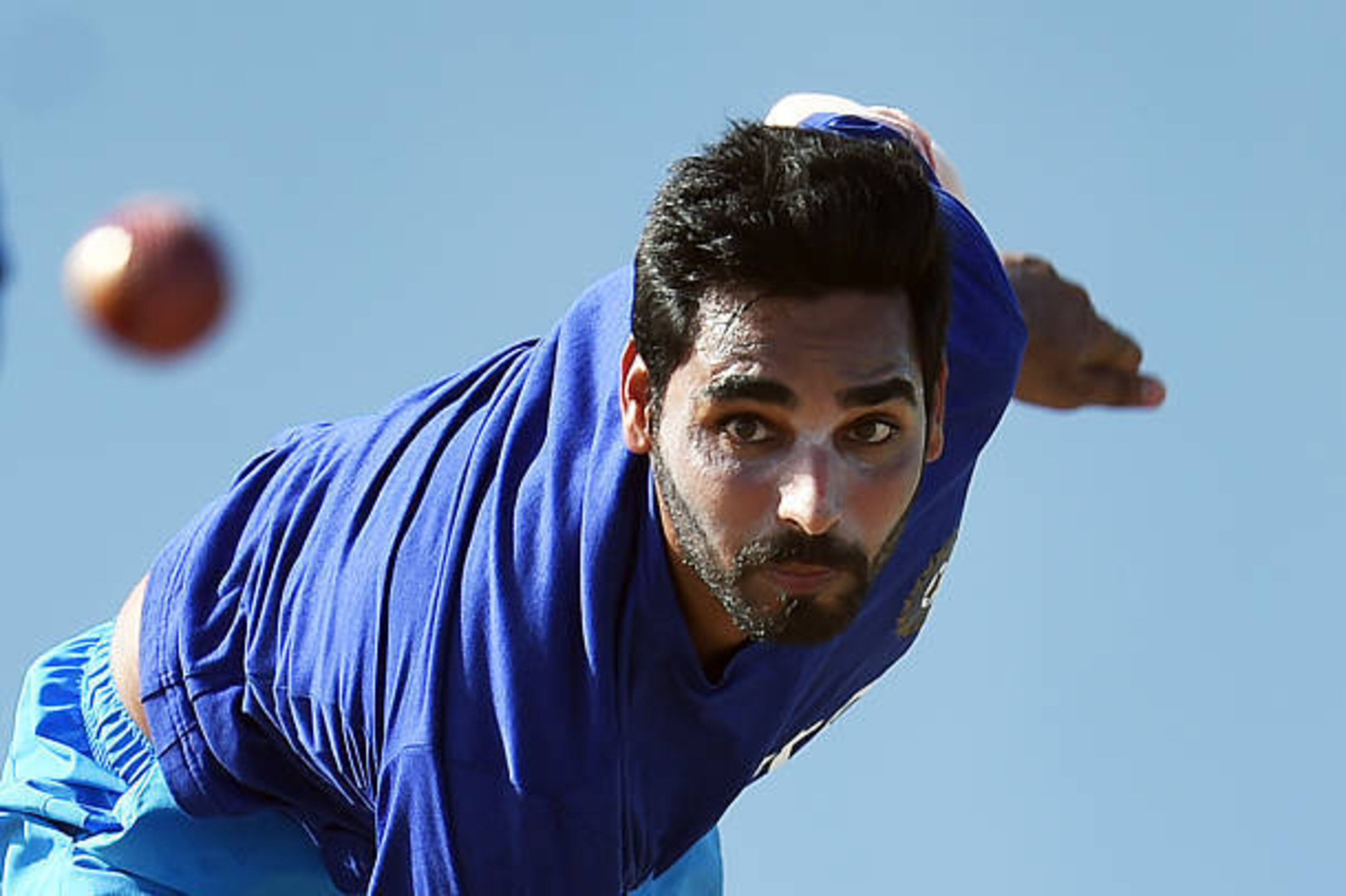 Indian cricketer Bhuvneshwar Kumar delivers a ball while practicing at the end of the three-day tour match between India and WICB President's XI squad at the Warner Park stadium in Basseterre, Saint Kitts, on July 16, 2016. / AFP / Jewel SAMAD        (Pho