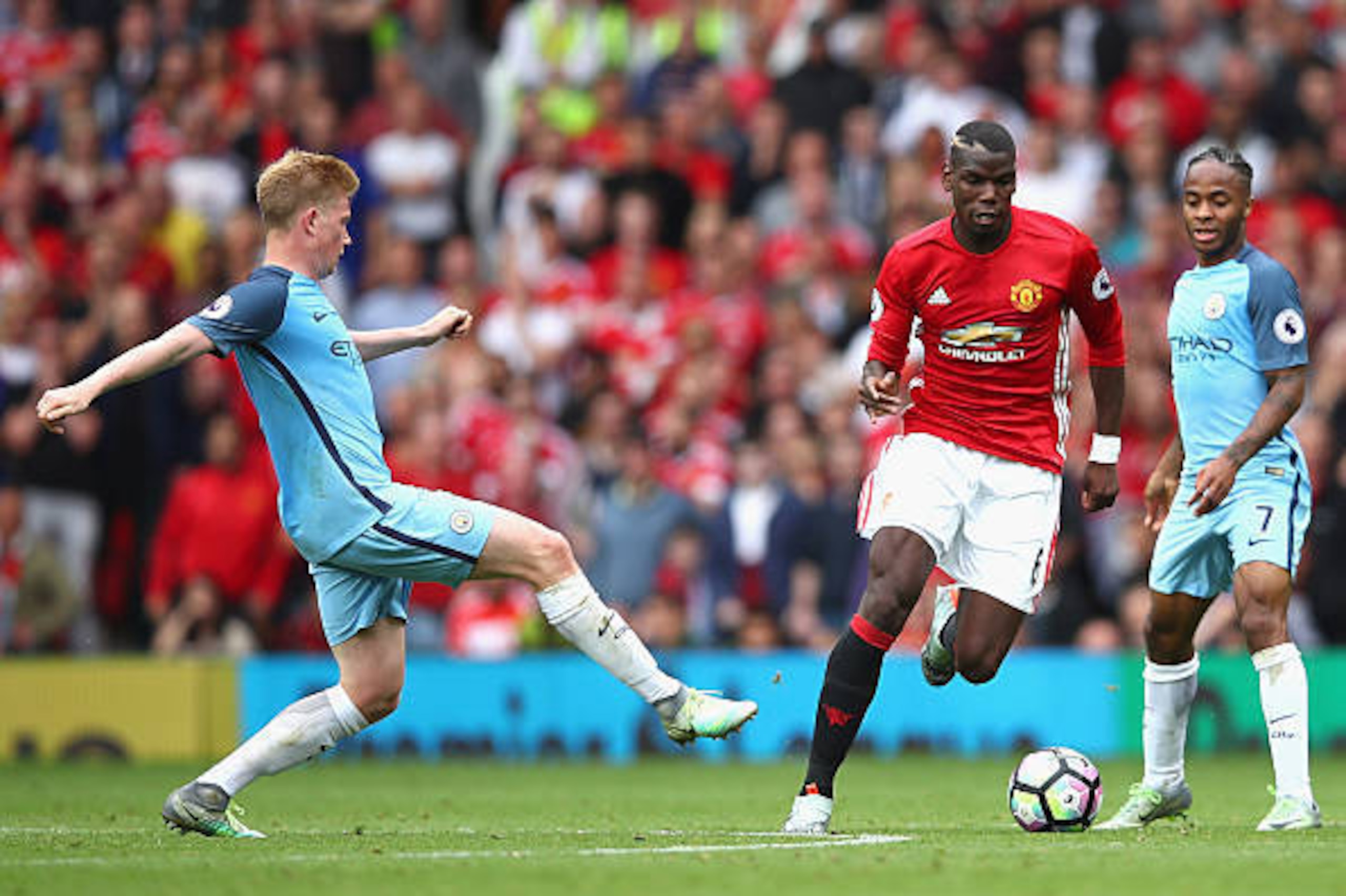 MANCHESTER, ENGLAND - SEPTEMBER 10:  Kevin De Bruyne of Manchester City challenges Paul Pogba of Manchester United during the Premier League match between Manchester United and Manchester City at Old Trafford on September 10, 2016 in Manchester, England. 