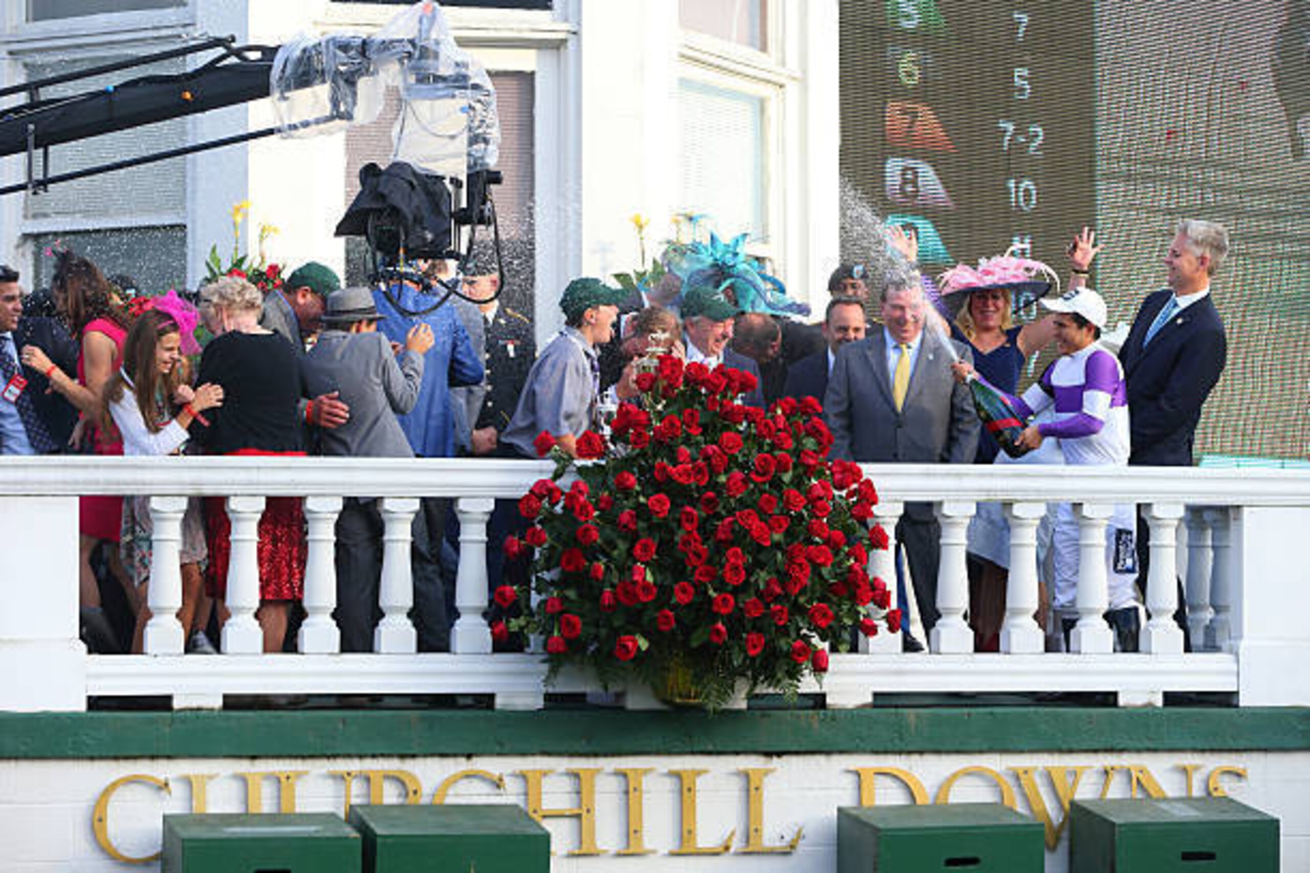 LOUISVILLE, KY - MAY 7: Jockey Mario Gutierrez sprays connections with champagne after winning the 2016 Kentucky Derby aboard Nyquist on May 7, 2016 at Churchill Downs, Louisville.  (Photo by Horsephotos/Getty Images)