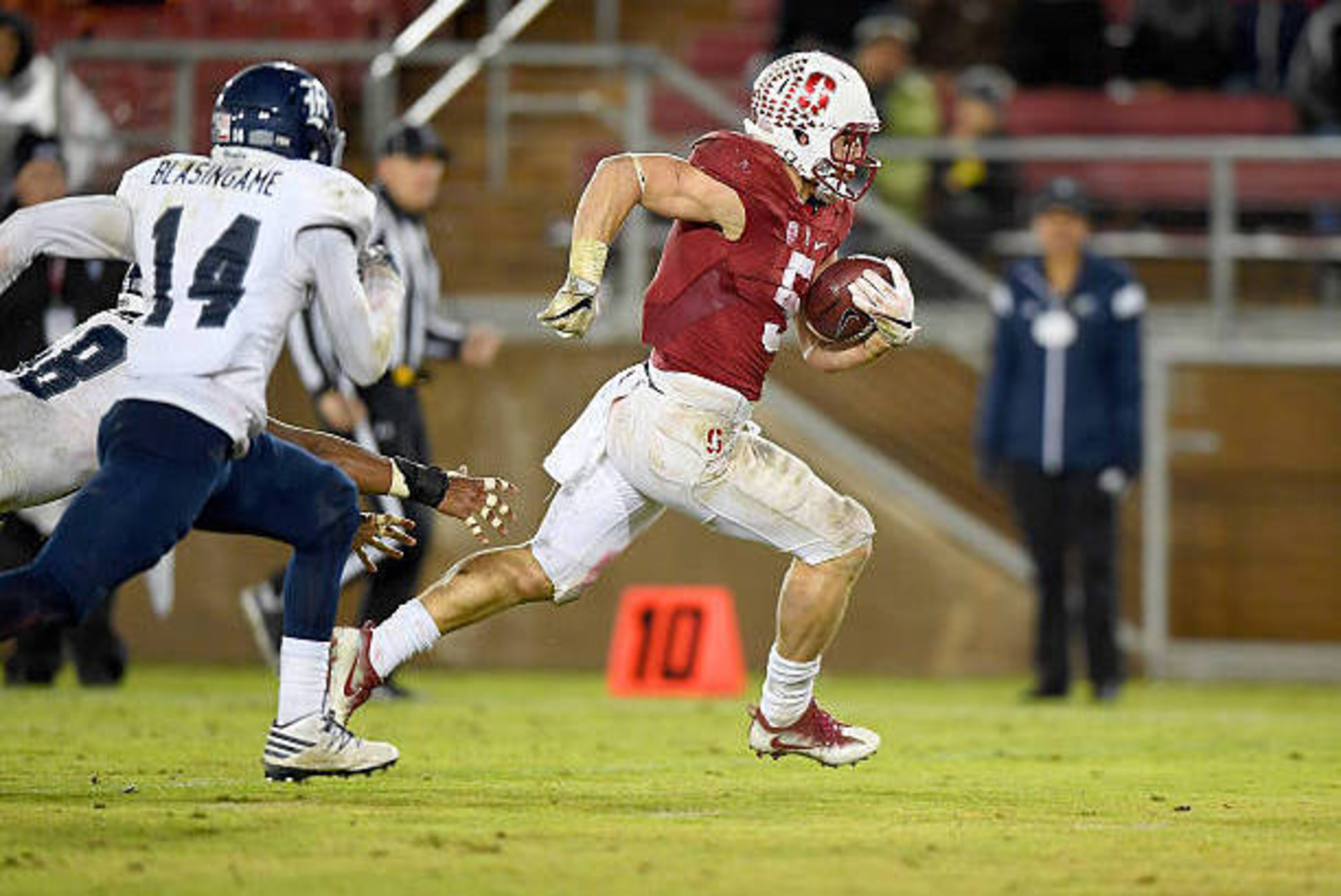 PALO ALTO, CA - NOVEMBER 26: Christian McCaffrey #5 of the Stanford Cardinal scores on a nineteen yard touchdown run against the Rice Owls in the third quarter of their NCAA football game at Stanford Stadium on November 26, 2016 in Palo Alto, California. PALO ALTO, CA - NOVEMBER 26: Christian McCaffrey #5 of the Stanford Cardinal scores on a nineteen yard touchdown run against the Rice Owls in the third quarter of their NCAA football game at Stanford Stadium on November 26, 2016 in Palo Alto, California.