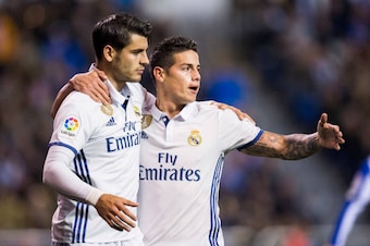 LA CORUNA, SPAIN - APRIL 26:  James Rodriguez of Real Madrid celebrates with his teammates Alvaro Morata of Real Madrid after scoring his team's fourth goal during the La Liga match between RC Deportivo La Coruna and Real Madrid at Riazor Stadium on April