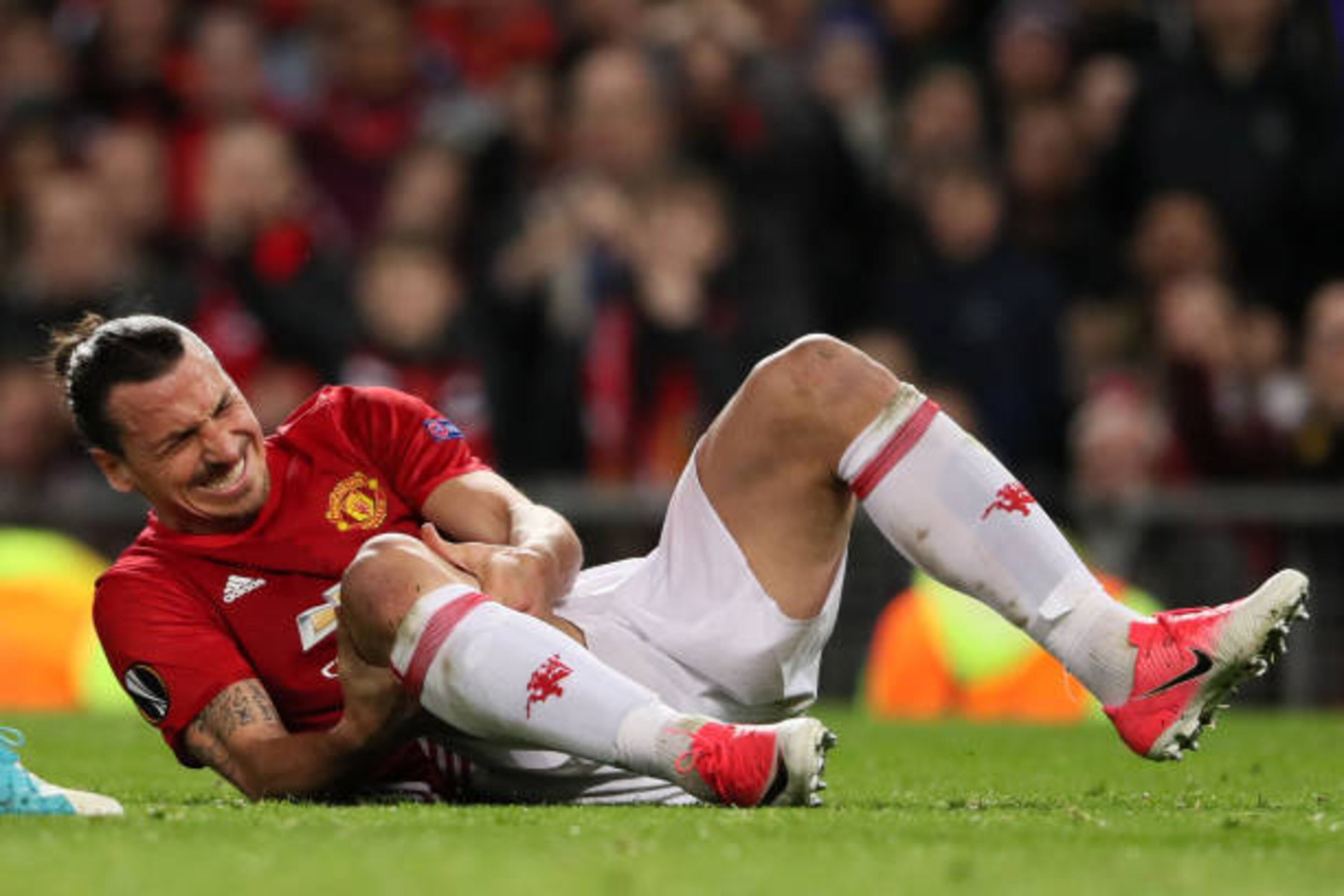 MANCHESTER, ENGLAND - APRIL 20:  Zlatan Ibrahimovic of Manchester United goes down injured during the UEFA Europa League quarter final second leg match between Manchester United and RSC Anderlecht at Old Trafford on March 20, 2017 in Manchester, United Ki