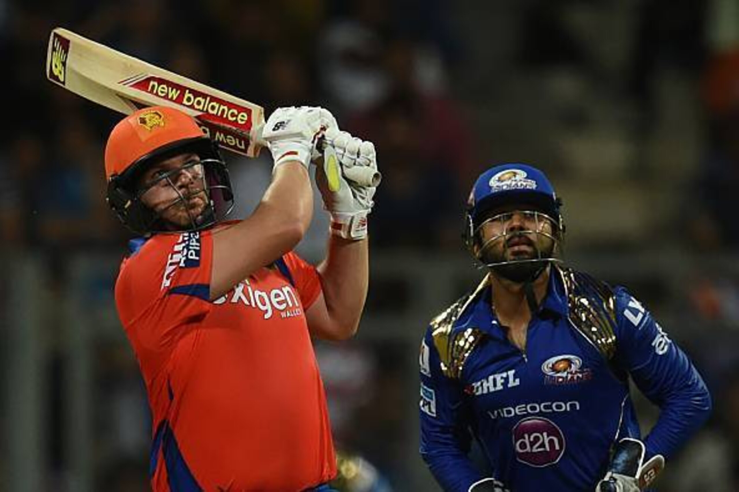 Gujarat Lions Aaron Finch (L) watched by Mumbai Indians wicketkeeper Parthiv Patel plays a shot during the 2016 Indian Premier League(IPL) Twenty20 cricket match between Gujarat Lions and Mumbai Indians at the Wankhede Stadium in Mumbai on April 16, 2016. Gujarat Lions Aaron Finch (L) watched by Mumbai Indians wicketkeeper Parthiv Patel plays a shot during the 2016 Indian Premier League(IPL) Twenty20 cricket match between Gujarat Lions and Mumbai Indians at the Wankhede Stadium in Mumbai on April 16, 2016.