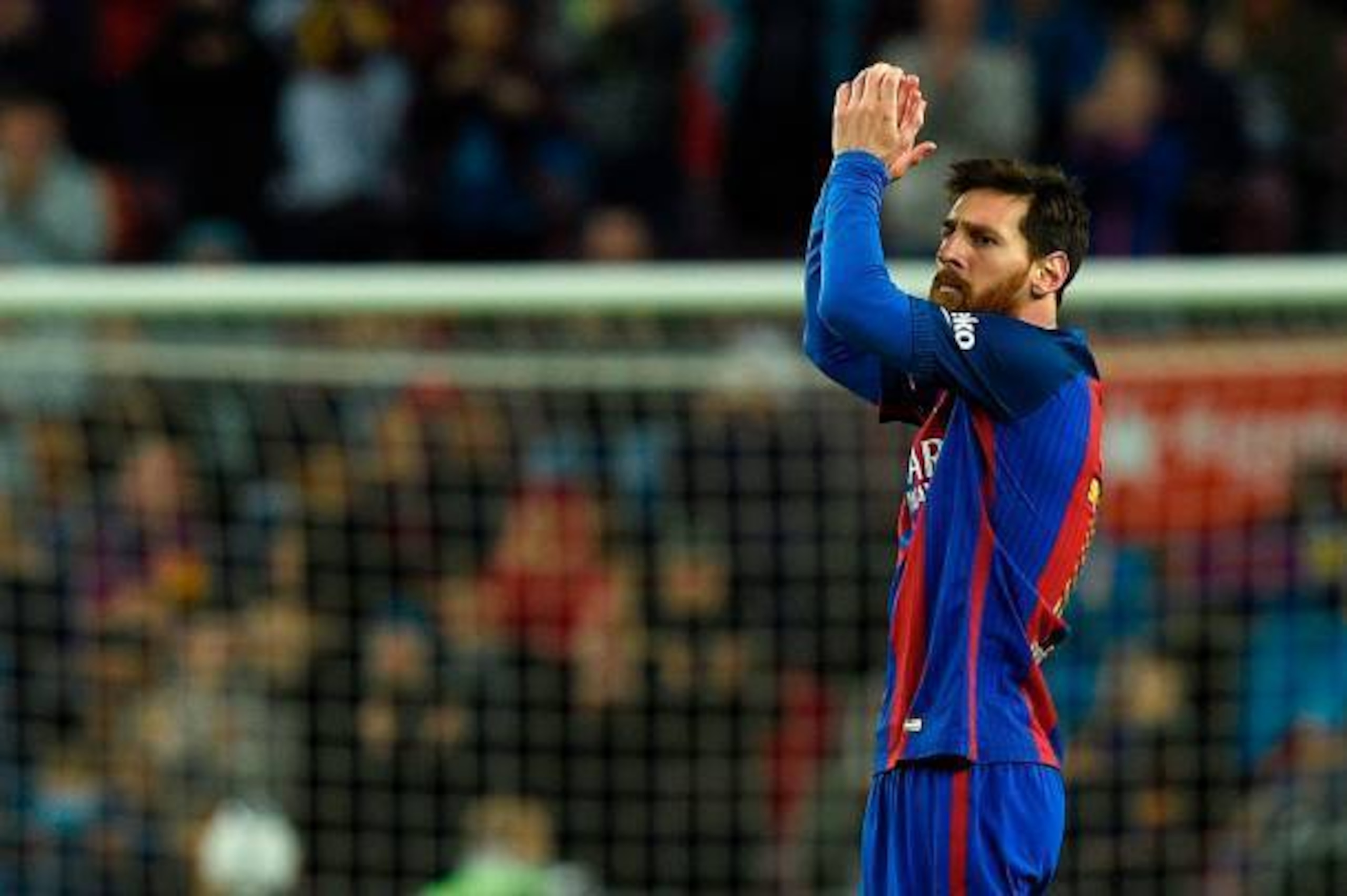Barcelona's Argentinian forward Lionel Messi celebrates after scoring a goal during the Spanish league football match FC Barcelona vs CA Osasuna at the Camp Nou stadium in Barcelona on April 26, 2017. / AFP PHOTO / LLUIS GENE        (Photo credit should r