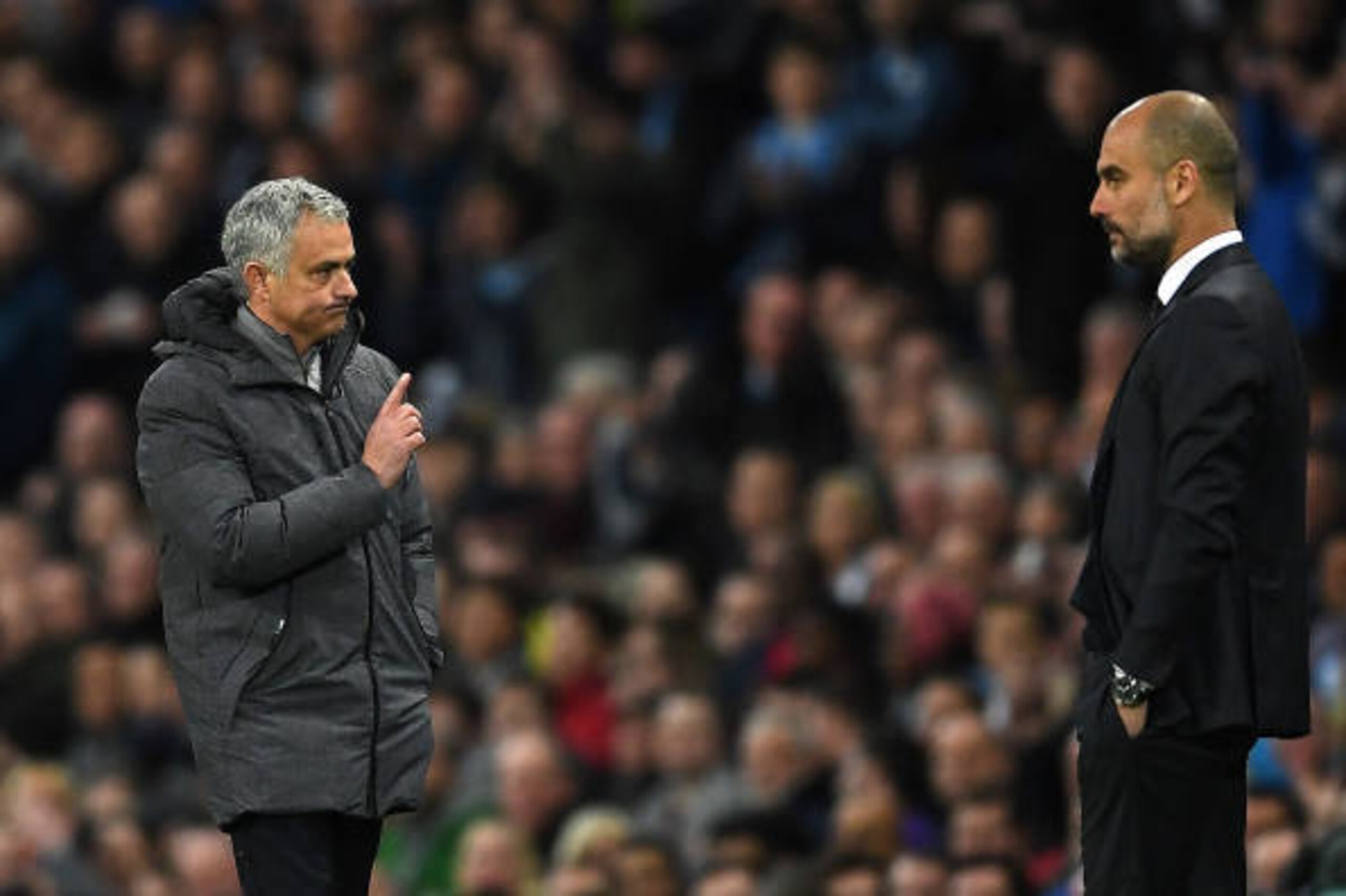 MANCHESTER, ENGLAND - APRIL 27: Jose Mourinho, Manager of Manchester United (L) and Josep Guardiola, Manager of Manchester City (R) during the Premier League match between Manchester City and Manchester United at Etihad Stadium on April 27, 2017 in Manche