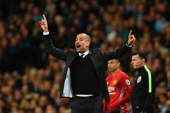 Manchester City's Spanish manager Pep Guardiola gestures on the touchline during the English Premier League football match between Manchester City and Manchester United at the Etihad Stadium in Manchester, north west England, on April 27, 2017. / AFP PHOT
