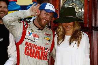 MARTINSVILLE, VA - OCTOBER 26:  Dale Earnhardt Jr., driver of the #88 National Guard Chevrolet, celebrates with girlfriend Amy Reimann in Victory Lane after his victory in the NASCAR Sprint Cup Series Goody's Headache Relief Shot 500 at Martinsville Speed