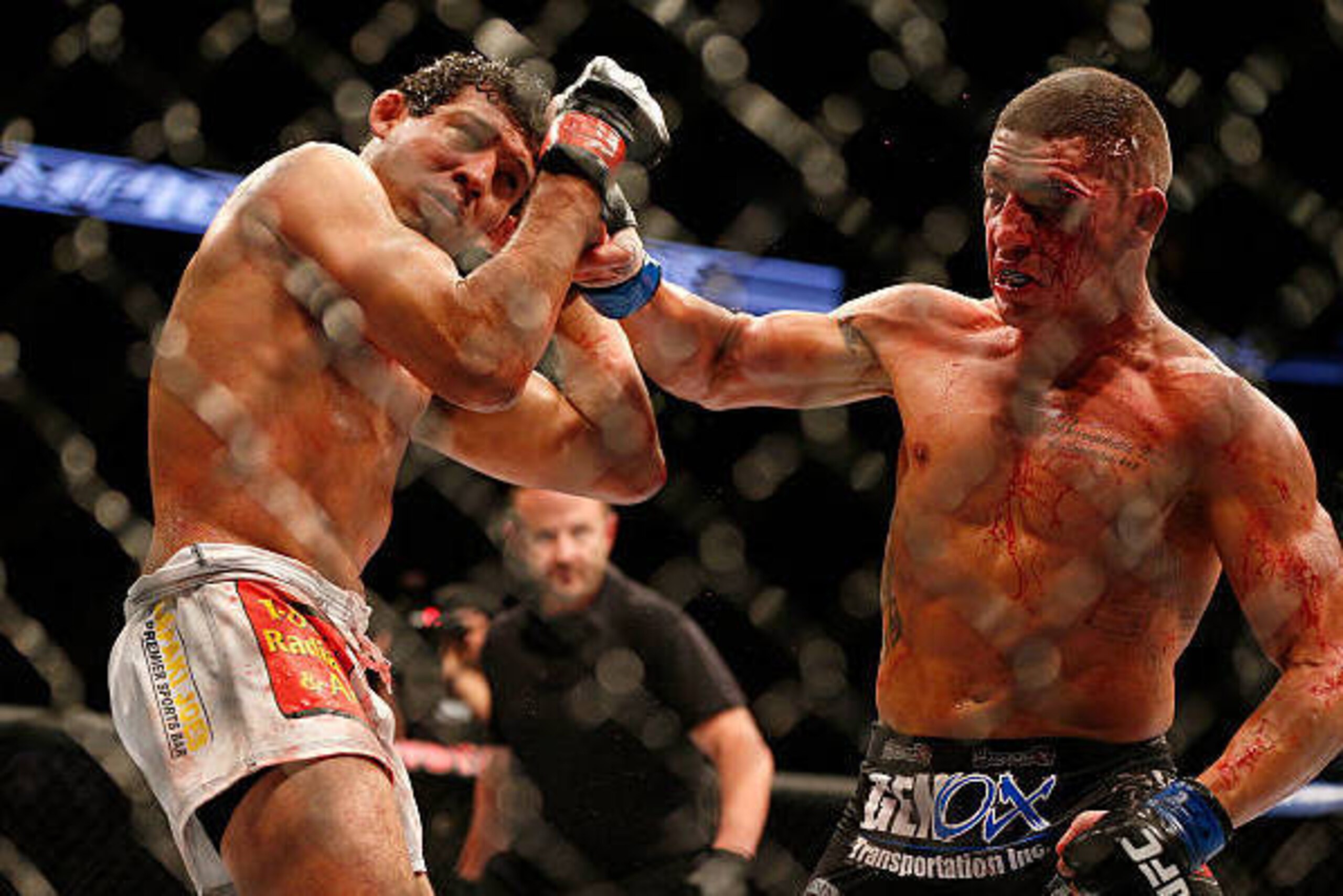 HOUSTON, TEXAS - OCTOBER 19:  (R-L) Diego Sanchez punches Gilbert Melendez in their UFC lightweight bout at the Toyota Center on October 19, 2013 in Houston, Texas. (Photo by Josh Hedges/Zuffa LLC/Zuffa LLC via Getty Images)