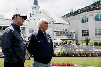 LOUISVILLE, KY - MAY 03: Kentucky Derby trainers Todd Pletcher (L) and Bob Baffert watch a race in the paddock while schooling horses at Churchill Downs on May 03, 2016 in Louisville, Kentucky.  (Photo by Rob Carr/Getty Images)