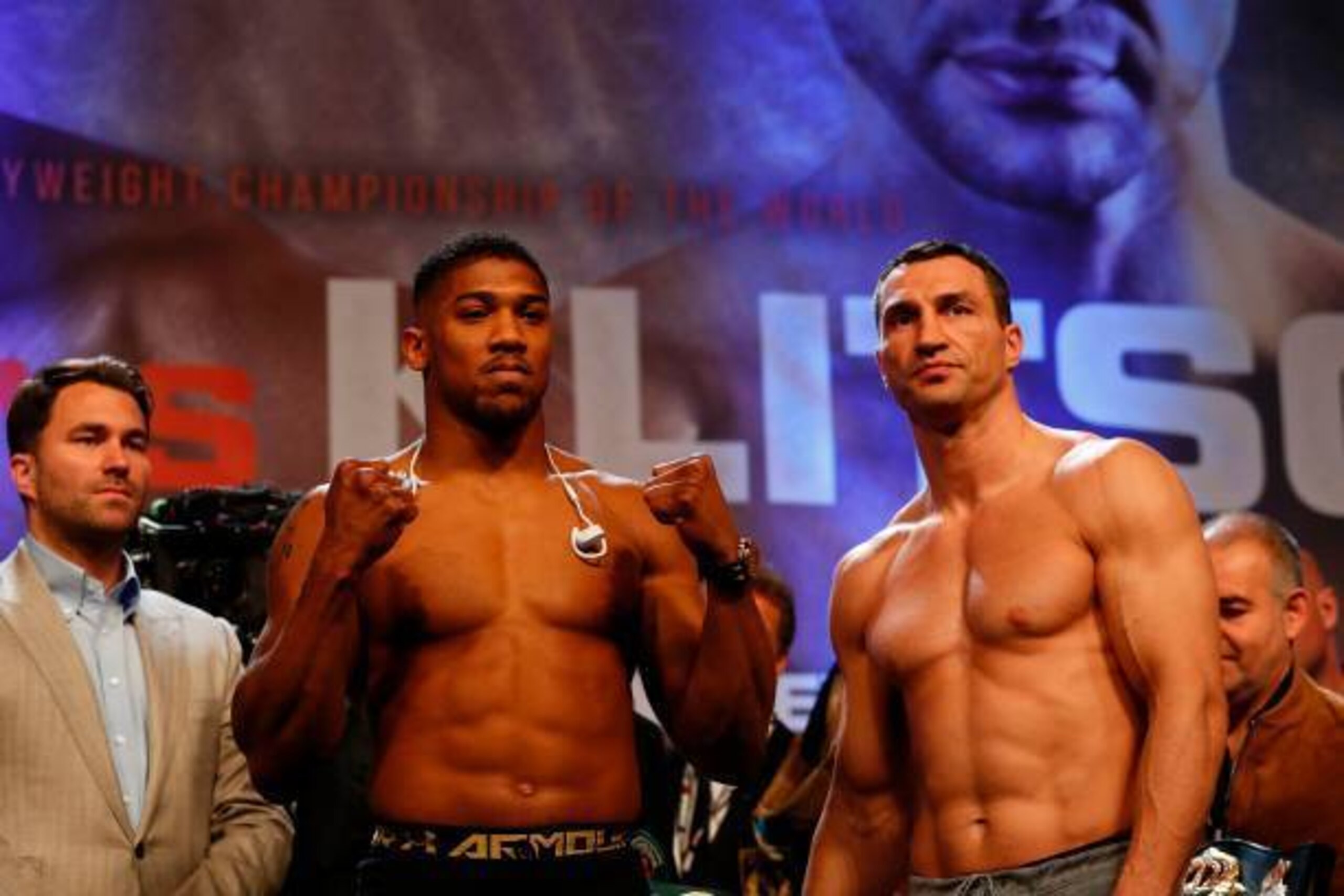 British boxer Anthony Joshua (L) and Ukrainian boxer Wladimir Klitschko (R) pose with each other during the weigh-in ahead of their world heavyweight title unification bout at Wembley in London on April 28, 2017.
British boxer Anthony Joshua bids to add t