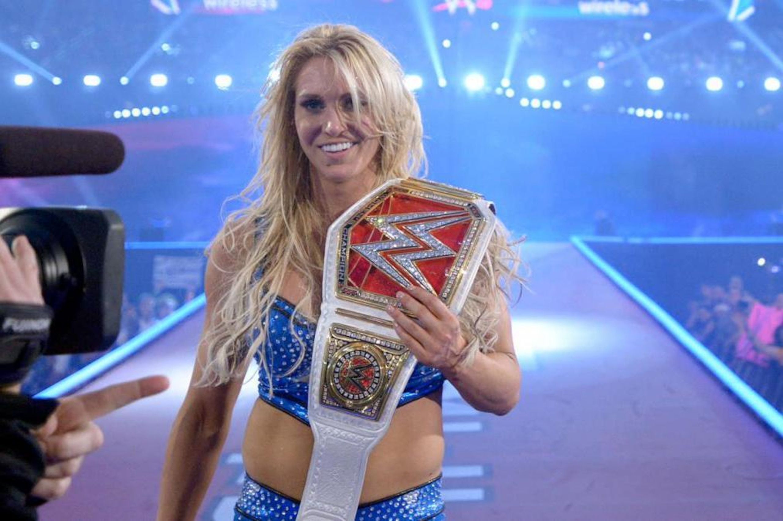 Charlotte Flair celebrates her title win at WrestleMania 32. Charlotte Flair celebrates her title win at WrestleMania 32.