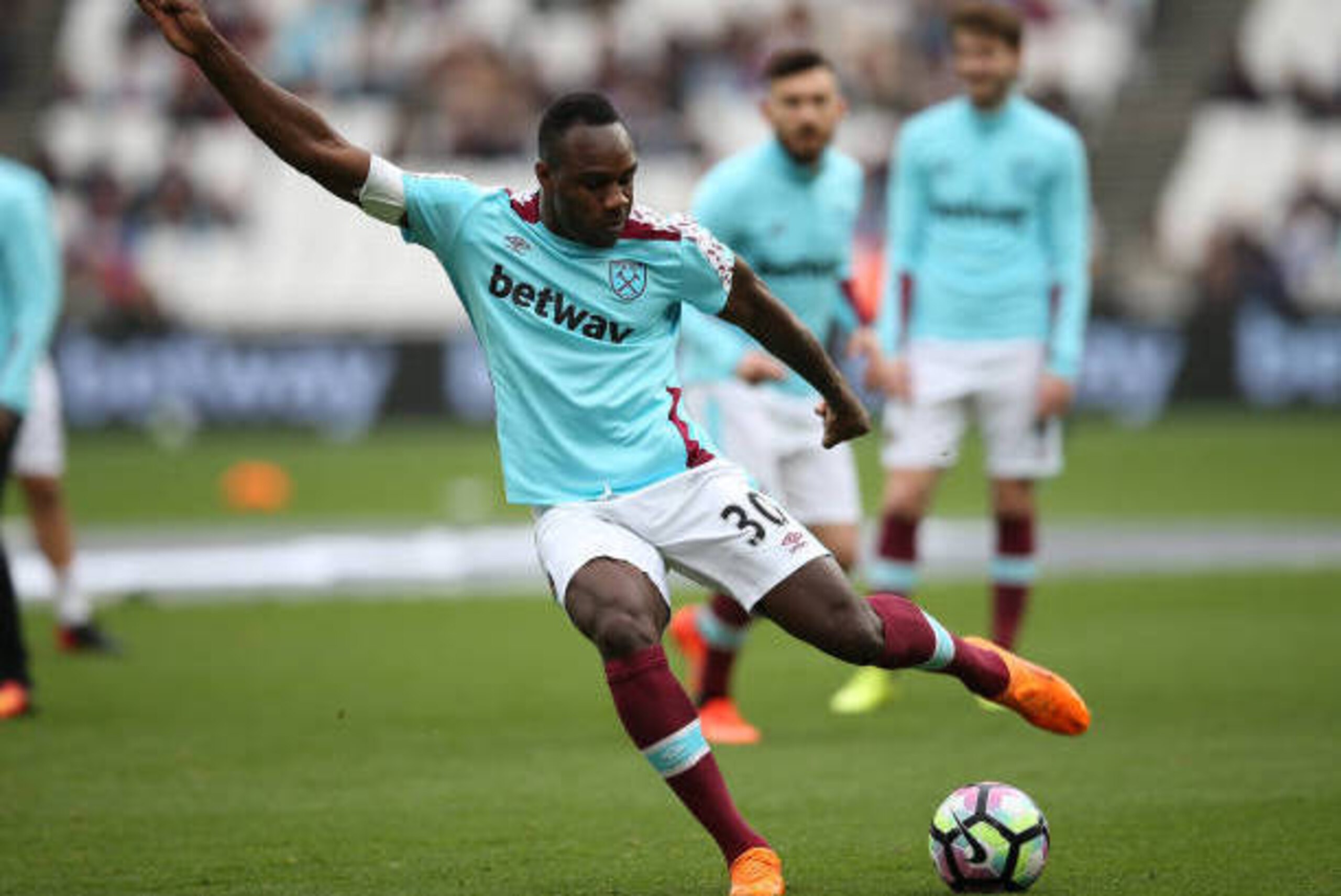 STRATFORD, ENGLAND - MARCH 18: Michail Antonio of West Ham United shoots during the warm up prior to the Premier League match between West Ham United and Leicester City at London Stadium on March 18, 2017 in Stratford, England.  (Photo by Steve Bardens/Ge