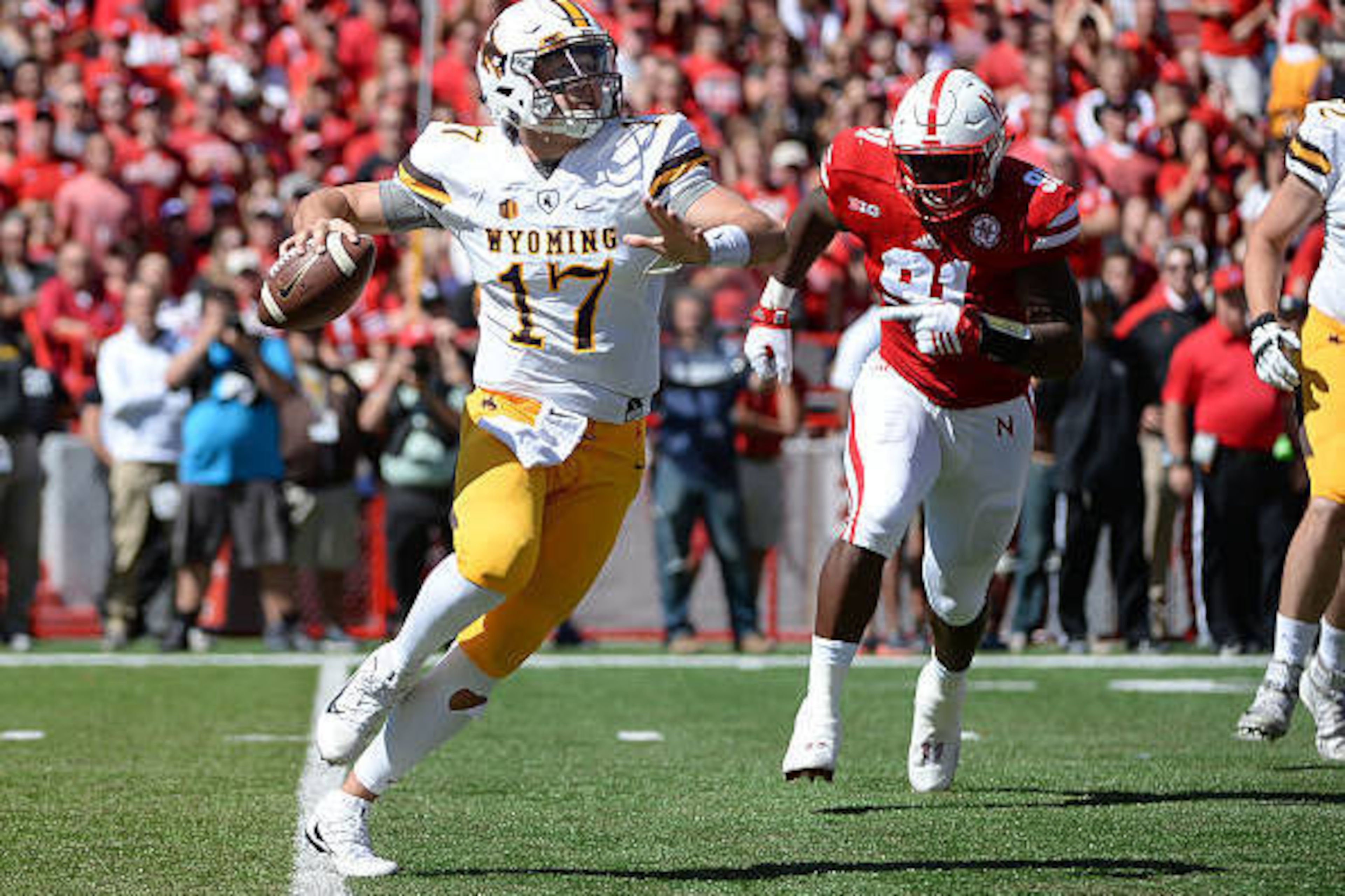 LINCOLN, NE - SEPTEMBER 10: Quarterback Josh Allen #17 of the Wyoming Cowboys passes against defensive end Freedom Akinmoladun #91 of the Nebraska Cornhuskers at Memorial Stadium on September 10, 2016 in Lincoln, Nebraska. (Photo by Steven Branscombe/Gett