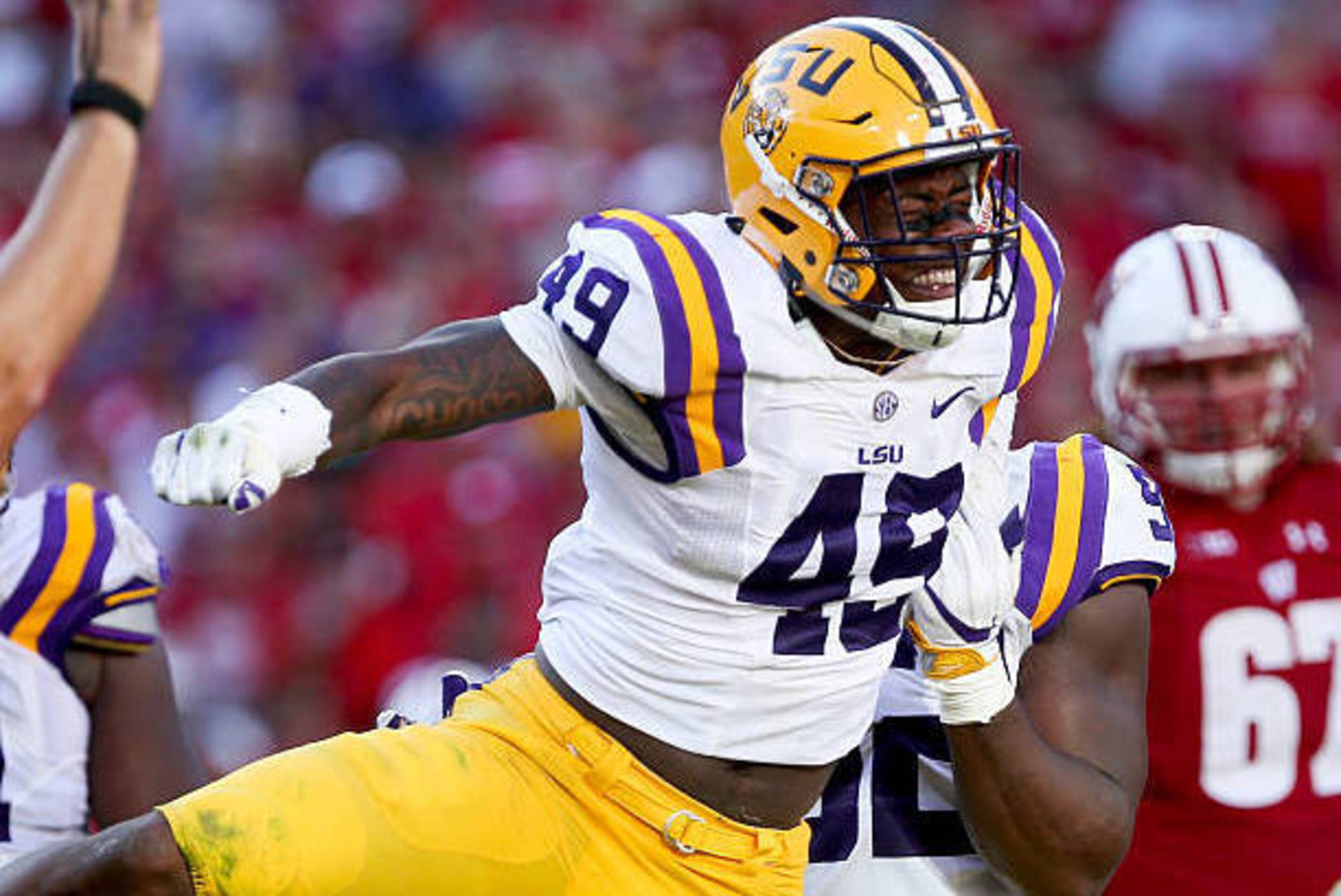 GREEN BAY, WI - SEPTEMBER 3:  Arden Key #49 of the LSU Tigers celebrates after making a sack in the fourth quarter against the Wisconsin Badgers at Lambeau Field on September 3, 2016 in Green Bay, Wisconsin. (Photo by Dylan Buell/Getty Images)