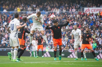MADRID, SPAIN - APRIL 29:  Cristiano Ronaldo of Real Madrid scores Real's opeing goal  during the La Liga match between Real Madrid CF and Valencia CF at Estadio Santiago Bernabeu on April 29, 2017 in Madrid, Spain.  (Photo by Denis Doyle/Getty Images)