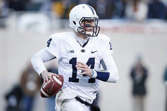 EAST LANSING, MI - NOVEMBER 28: Christian Hackenberg #14 of the Penn State Nittany Lions looks to pass against the Michigan State Spartans during the game at Spartan Stadium on November 28, 2015 in East Lansing, Michigan. Michigan State defeated Penn Stat