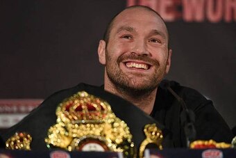 British heavyweight boxer Tyson Fury reacts during a press conference to publicise his forthcoming world heavyweight title fight against Ukranian heavyweight Wladimir Klitschko, at the Manchester Arena in Manchester, north-west England on April 27, 2016.
