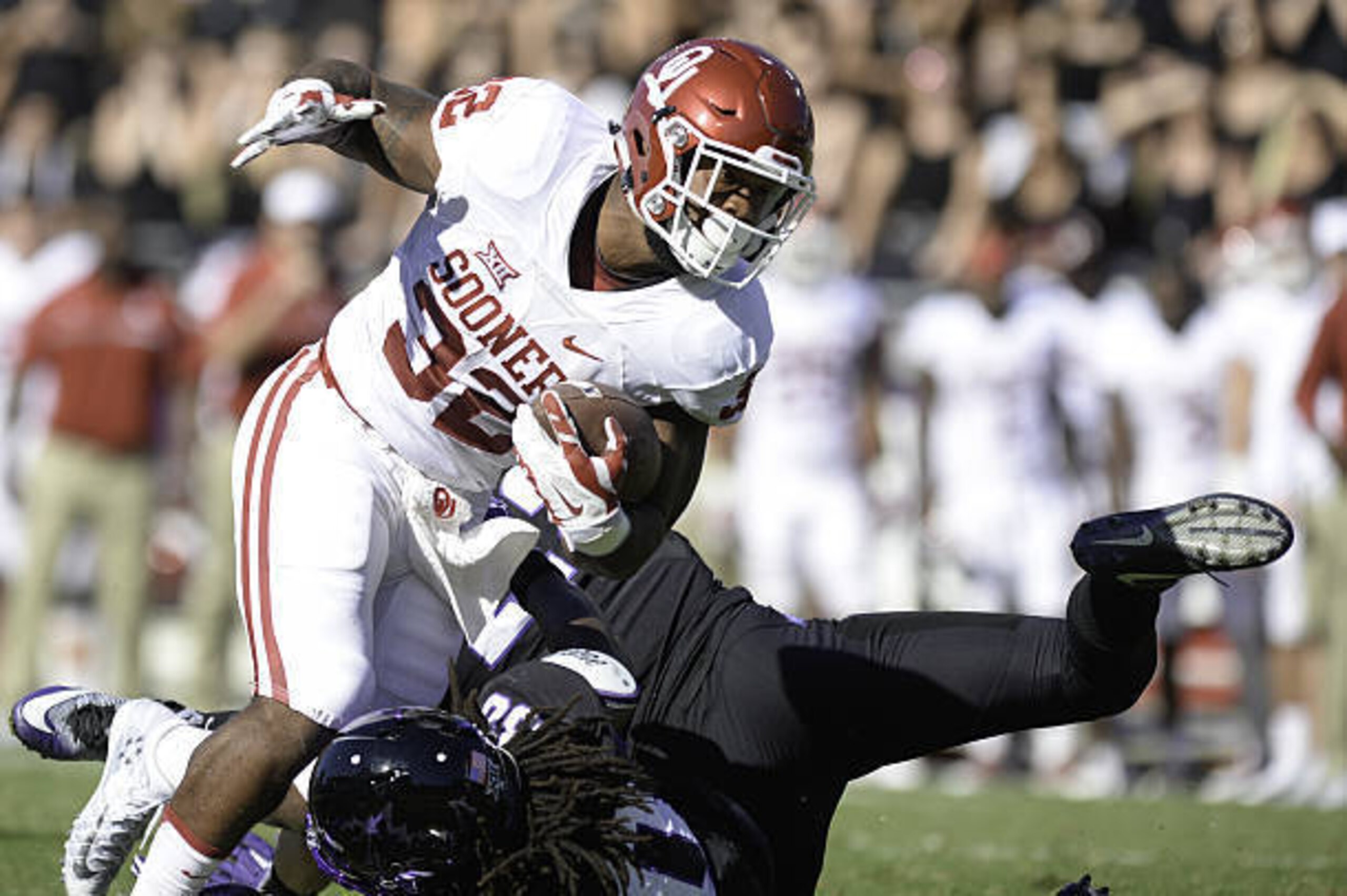 FORT WORTH, TX - OCTOBER 01: Running back Samaje Perine #32 of the Oklahoma Sooners tries to run the ball over safety Denzel Johnson #30 of the TCU Horned Frogs at Amon G. Carter Stadium on October 1, 2016 in Fort Worth, Texas. (Photo by Joshua Gateley/Ge FORT WORTH, TX - OCTOBER 01: Running back Samaje Perine #32 of the Oklahoma Sooners tries to run the ball over safety Denzel Johnson #30 of the TCU Horned Frogs at Amon G. Carter Stadium on October 1, 2016 in Fort Worth, Texas. (Photo by Joshua Gateley/Ge