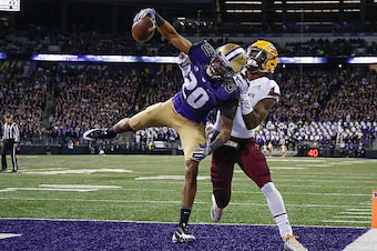 SEATTLE, WA - NOVEMBER 19:  Defensive back Kevin King #20 of the Washington Huskies makes an interception in the end zone against wide receiver N'Keal Harry #1 of the Arizona State Sun Devils on November 19, 2016 at Husky Stadium in Seattle, Washington.  