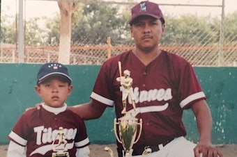 Julio Urias and his father, Carlos, who watched his son endure three surgeries on his left eye by the time he was two to treat a benign tumor.