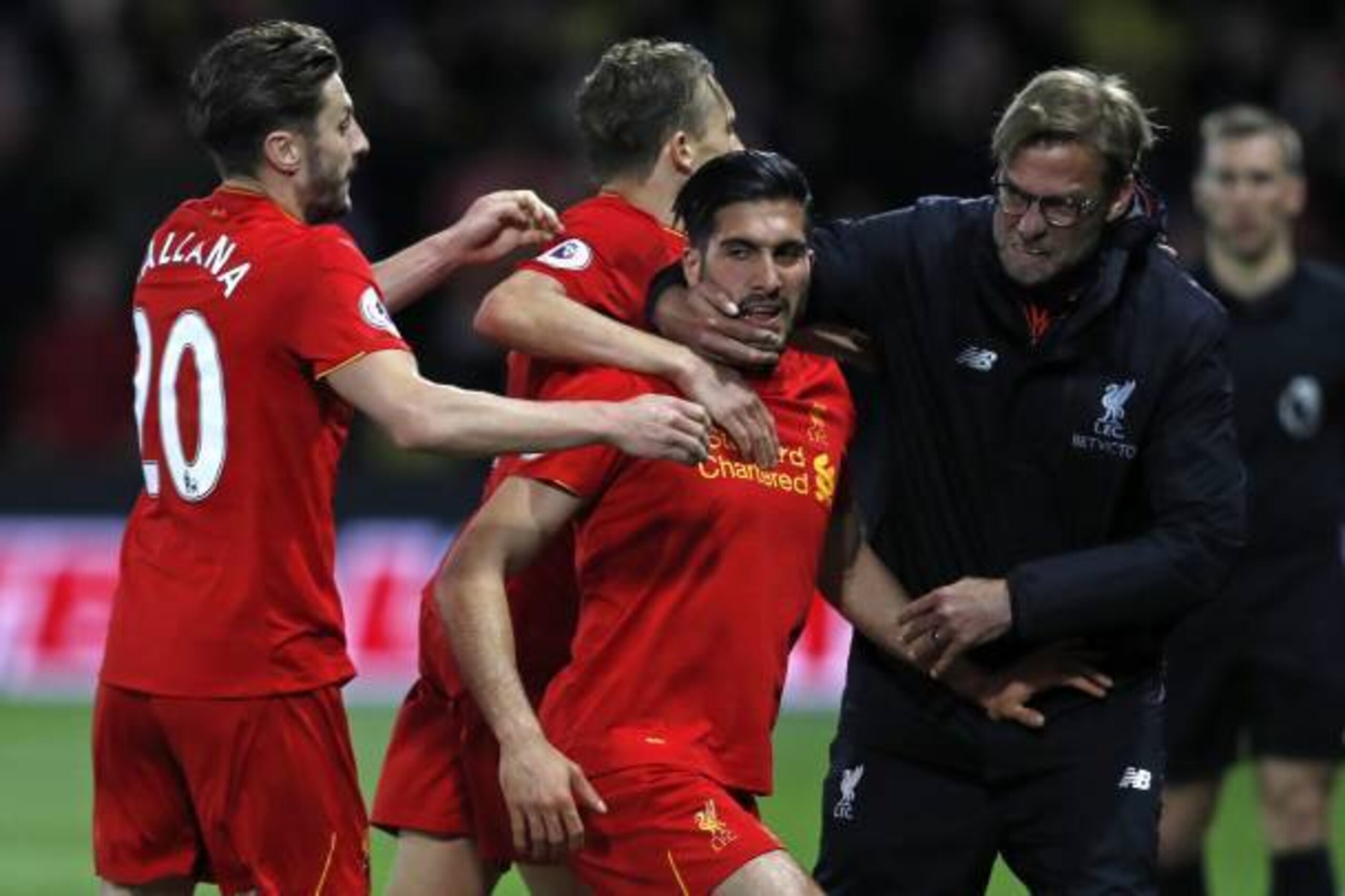 Liverpool's German midfielder Emre Can (C) celebrates with Liverpool's English midfielder Adam Lallana (L), Liverpool's Brazilian midfielder Lucas Leiva (2nd L) and Liverpool's German manager Jurgen Klopp after scoring the opening goal of the English Prem