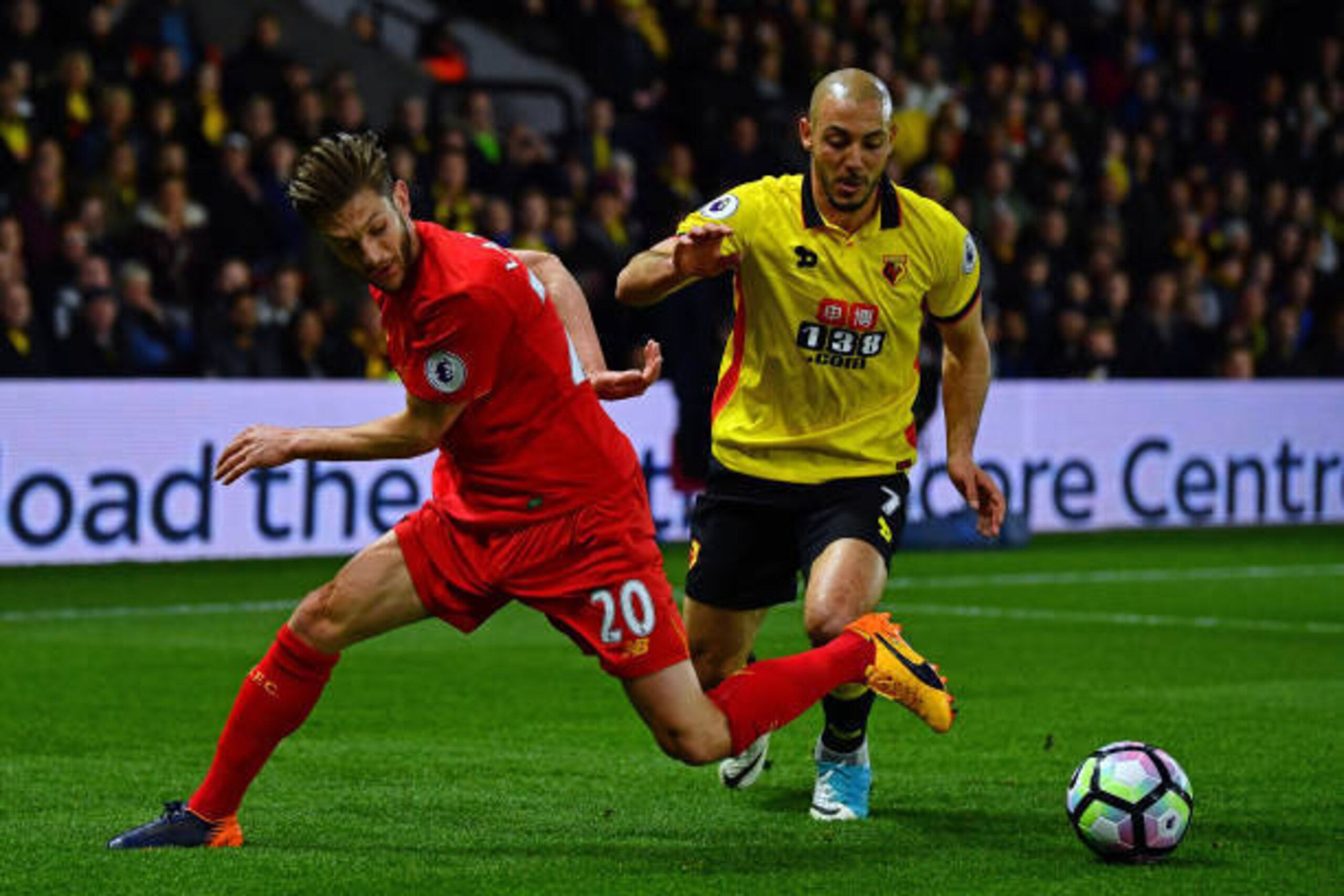 WATFORD, ENGLAND - MAY 01:  Adam Lallana of Liverpool is tackled by Nordin Amrabat of Watford during the Premier League match between Watford and Liverpool at Vicarage Road on May 1, 2017 in Watford, England.  (Photo by Dan Mullan/Getty Images)