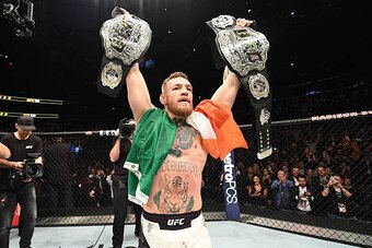 NEW YORK, NY - NOVEMBER 12:  UFC lightweight and featherweight champion Conor McGregor of Ireland celebrates after defeating Eddie Alvarez in their UFC lightweight championship fight during the UFC 205 event at Madison Square Garden on November 12, 2016 i