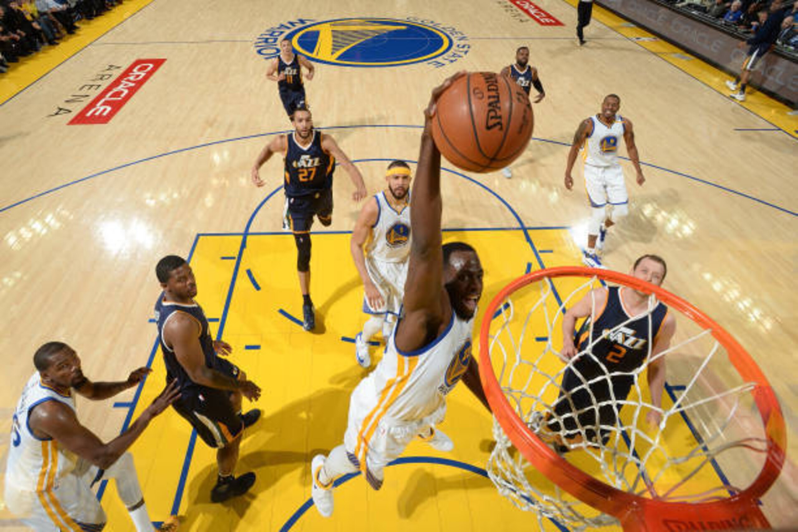 OAKLAND, CA - APRIL 10: Draymond Green #23 of the Golden State Warriors dunks against the Utah Jazz on April 10, 2017 at ORACLE Arena in Oakland, California. NOTE TO USER: User expressly acknowledges and agrees that, by downloading and or using this photo