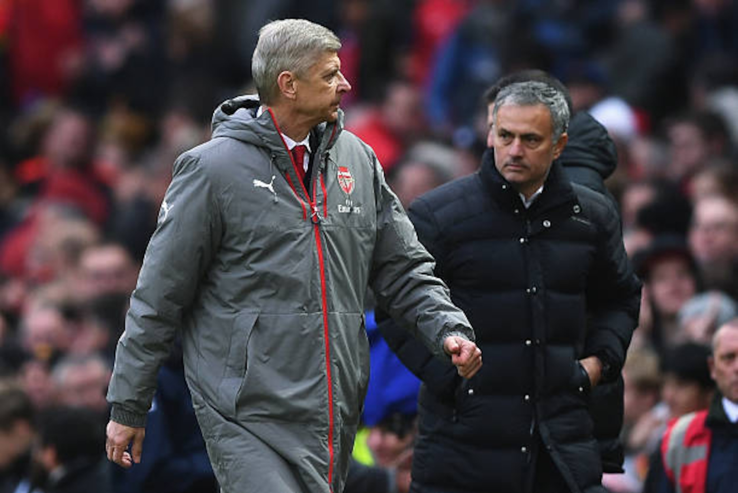MANCHESTER, ENGLAND - NOVEMBER 19:  Arsene Wenger, Manager of Arsenal (L) and Jose Mourinho, Manager of Manchester United (R) walk towards the tunnel after the final whistle during the Premier League match between Manchester United and Arsenal at Old Traf