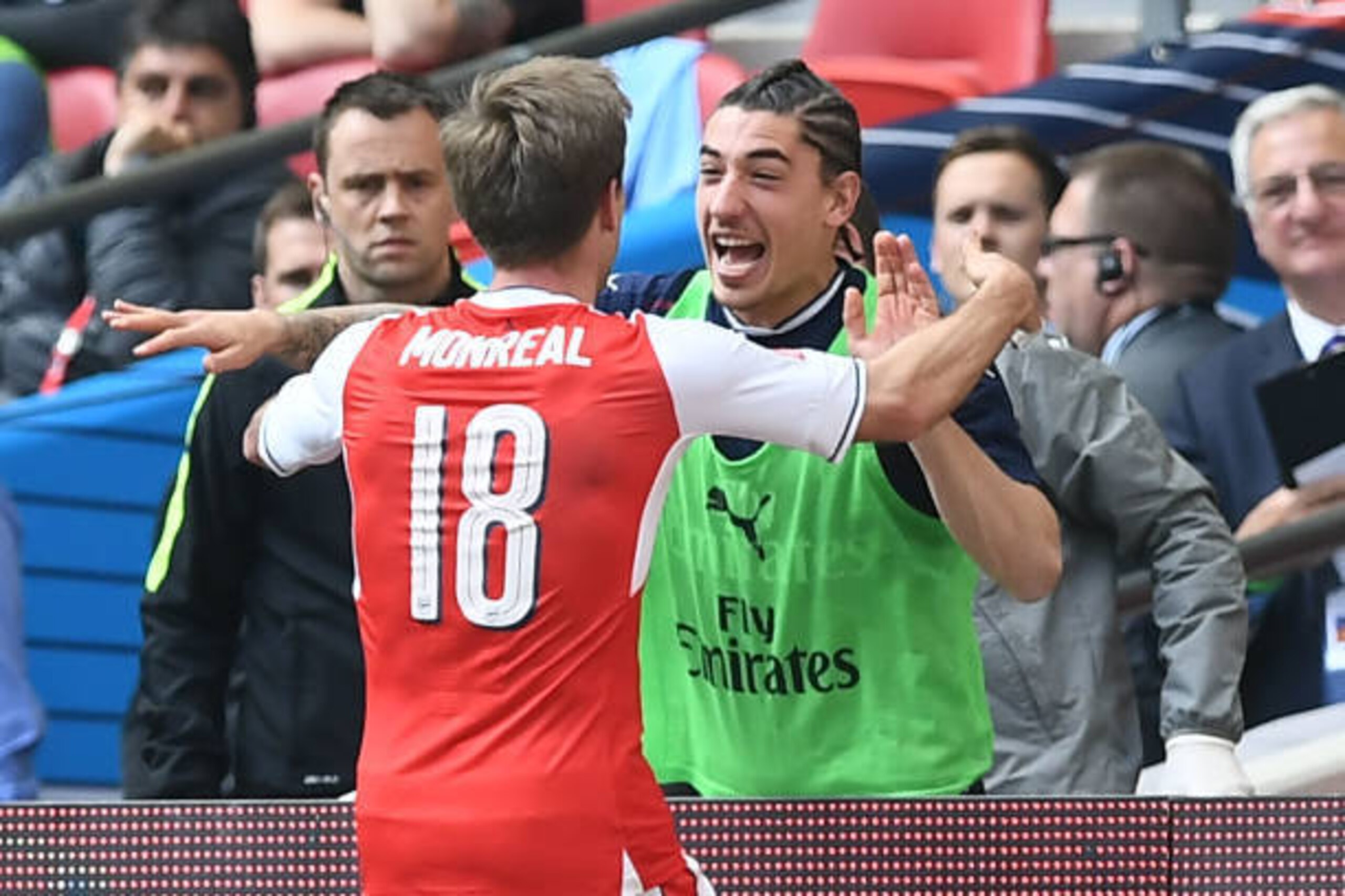 Arsenal's Spanish defender Nacho Monreal (L) celebrates scoring their first goal with Arsenal's Spanish defender Hector Bellerin during the FA Cup semi-final football match between Arsenal and Manchester City at Wembley stadium in London on April 23, 2017