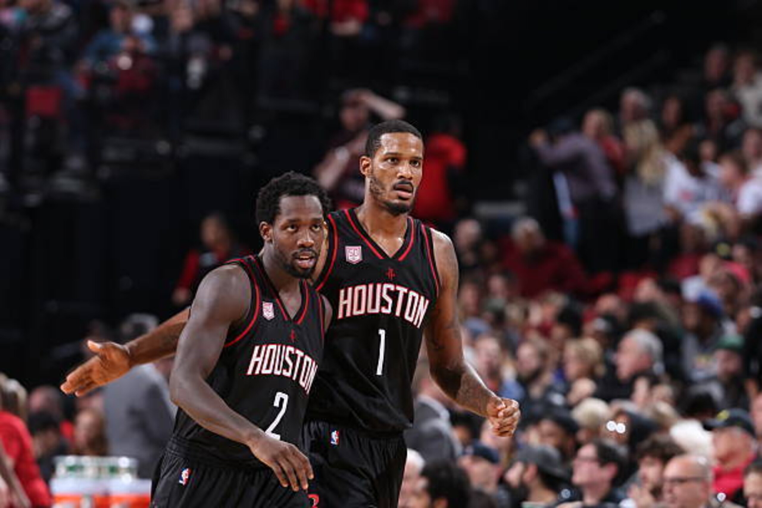 PORTLAND, OR - NOVEMBER 27: Trevor Ariza #1 and Patrick Beverley #2 of the Houston Rockets react during the game against the Portland Trail Blazers on November 27, 2016 at the Moda Center in Portland, Oregon. NOTE TO USER: User expressly acknowledges and PORTLAND, OR - NOVEMBER 27: Trevor Ariza #1 and Patrick Beverley #2 of the Houston Rockets react during the game against the Portland Trail Blazers on November 27, 2016 at the Moda Center in Portland, Oregon. NOTE TO USER: User expressly acknowledges and