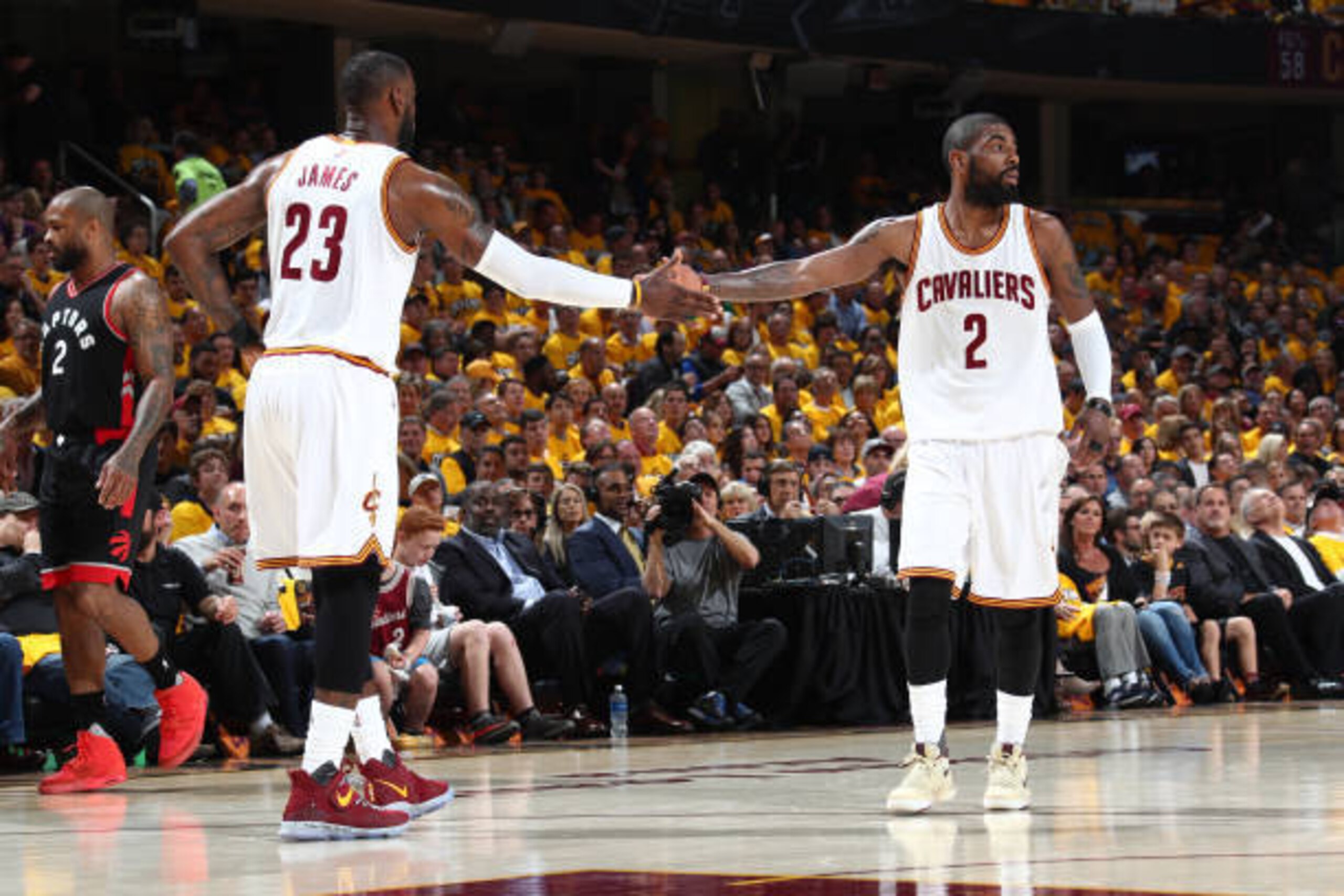 CLEVELAND, OH - MAY 1:  Kyrie Irving #2 and LeBron James #23 of the Cleveland Cavaliers high five against the Toronto Raptors in Game One of the Eastern Conference Semifinals of the 2017 NBA Playoffs on May 1, 2017 at Quicken Loans Arena in Cleveland, Ohi