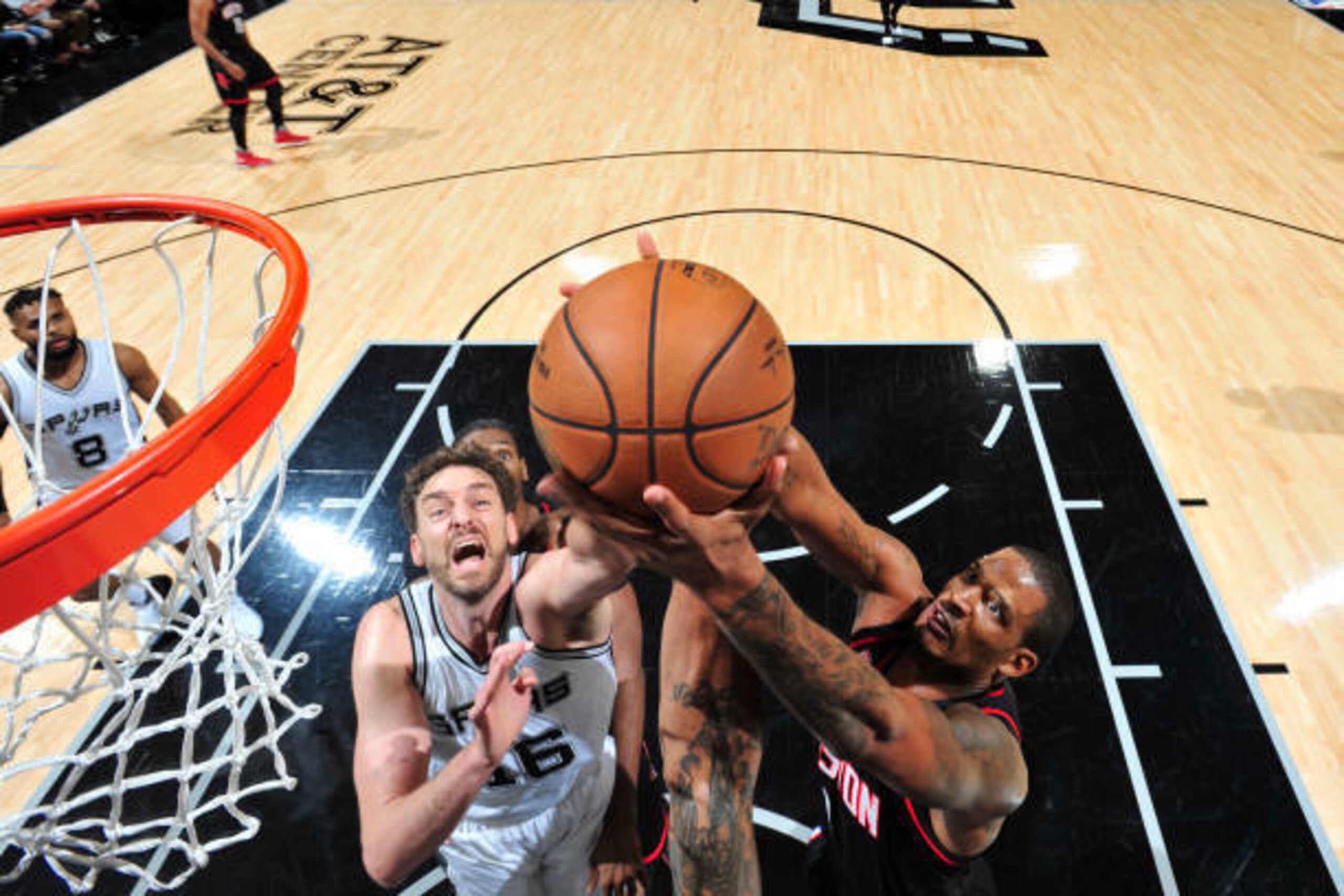 SAN ANTONIO, TX - MAY 1: Trevor Ariza #1 of the Houston Rockets goes for the rebound against Pau Gasol #16 of the San Antonio Spurs during Game One of the Western Conference Semifinals of the 2017 NBA Playoffs on May 1, 2017 at AT&T Center in San Antonio,