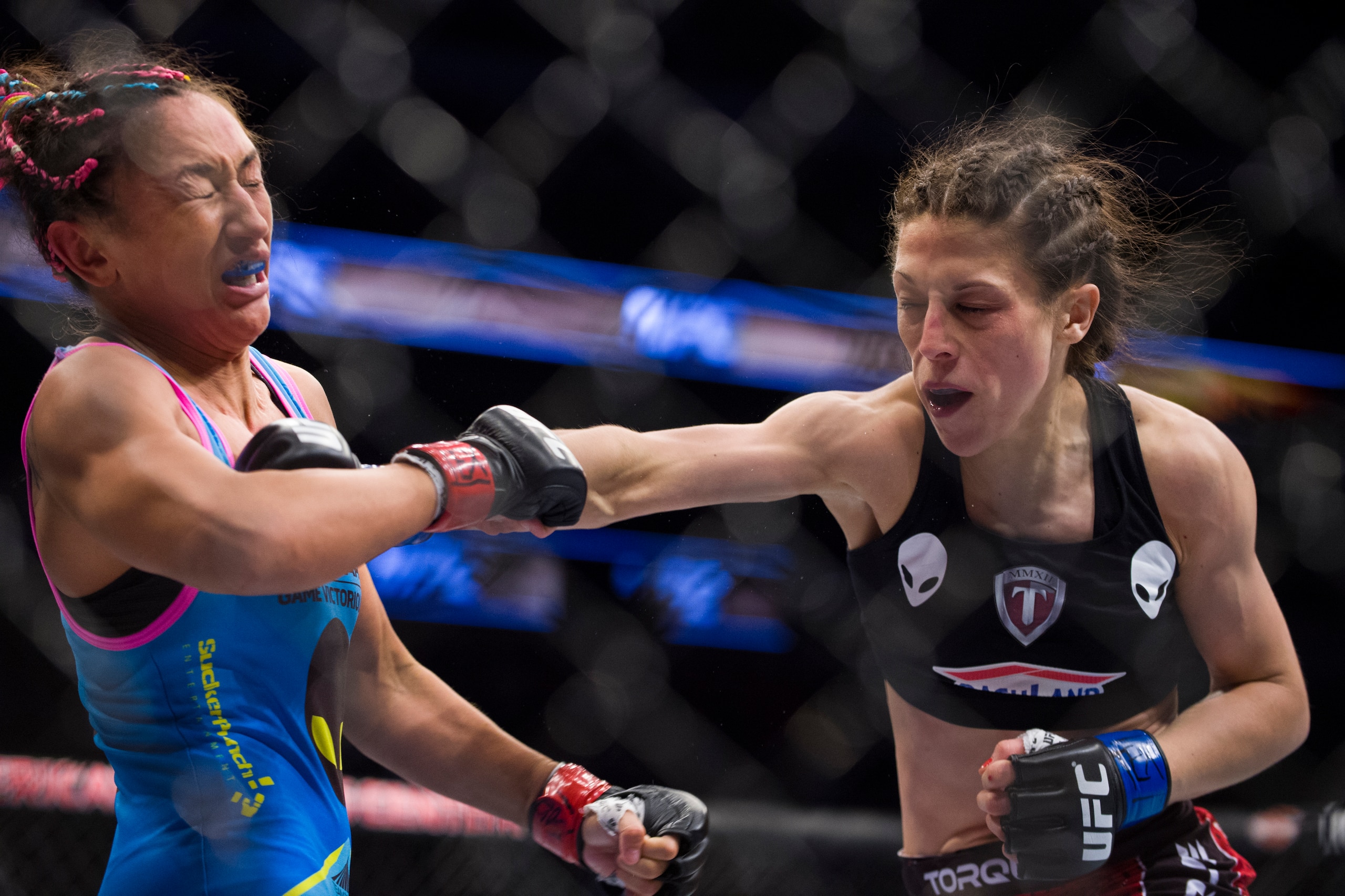 DALLAS, TX - MARCH 14:  Joanna Jedrzejczyk punches Carla Esparza during UFC 185 at the American Airlines Center on March 14, 2015 in Dallas, Texas. (Photo by Cooper Neill/Zuffa LLC/Zuffa LLC via Getty Images)