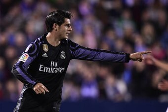 Real Madrid's forward Alvaro Morata celebrates after scoring their third goal during the Spanish league football match Club Deportivo Leganes SAD vs Real Madrid CF at the Estadio Municipal Butarque in Leganes on the outskirts of Madrid on April 5, 2017. /