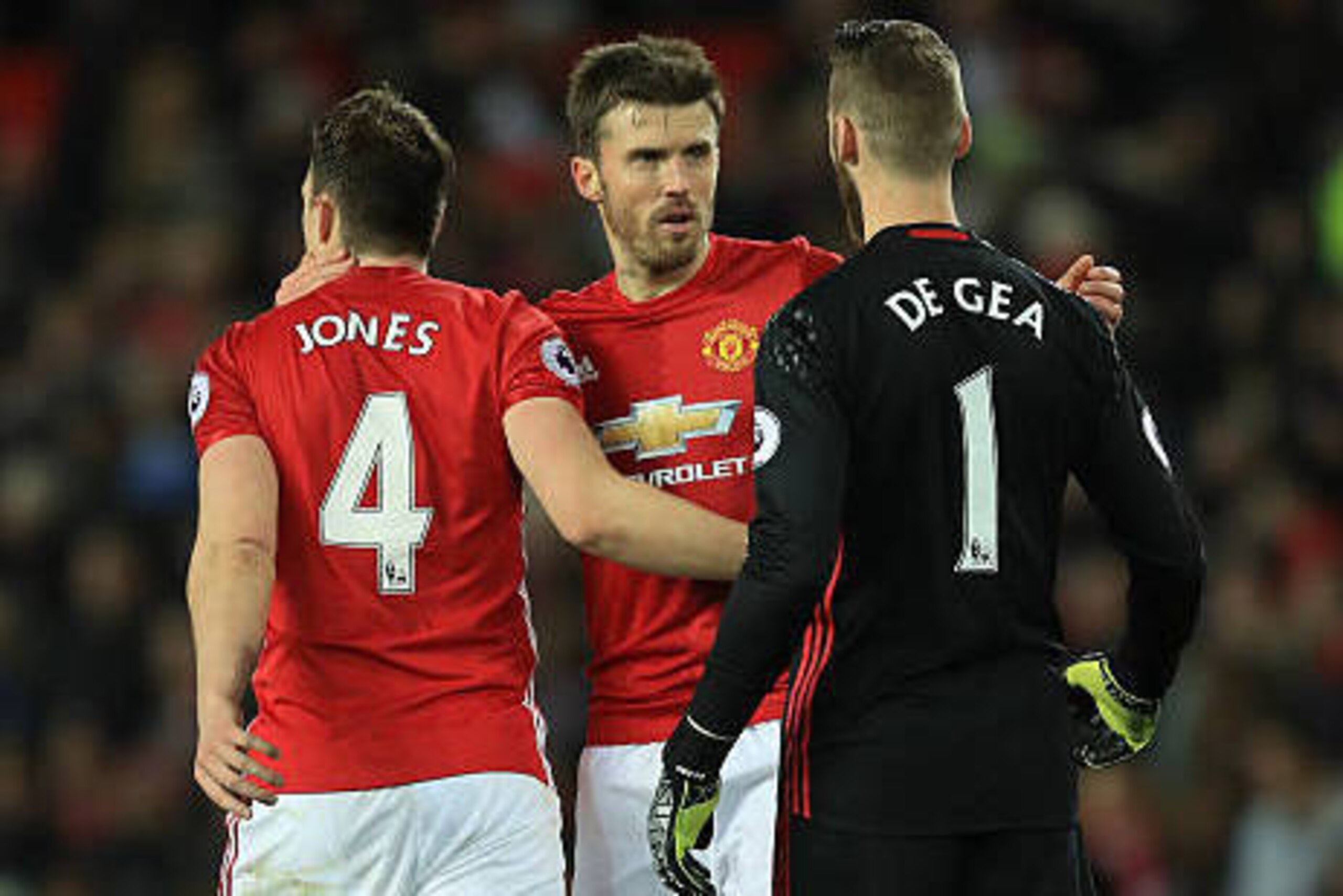 MANCHESTER, ENGLAND - DECEMBER 11: (L to R) Phil Jones, Michael Carrick and David De Gea of Manchester United celebrate their 1-0 win after the Premier League match between Manchester United and Tottenham Hotspur at Old Trafford on December 11, 2016 in Ma