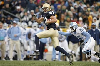SOUTH BEND - NOVEMBER 4:  Jeff Samardzija #83 of the Notre Dame Fighting Irish runs with the football after making a catch against the North Carolina Tar Heels at Notre Dame Stadium on November 4, 2006 in South Bend, Indiana. The Irish defeated the Tar He