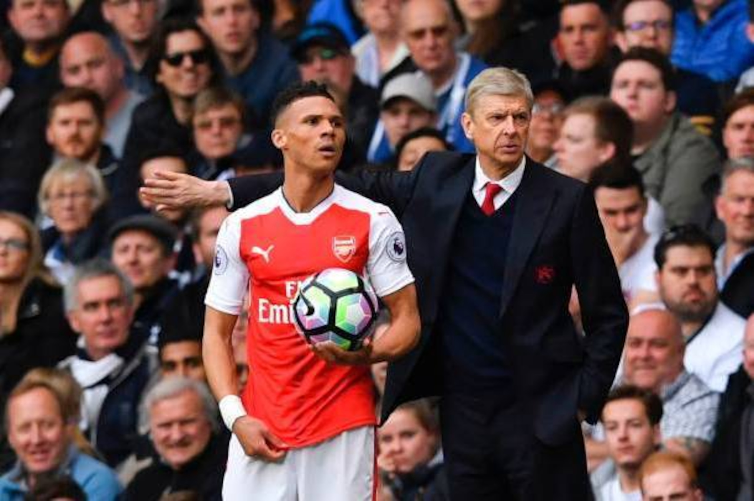Arsenal's French manager Arsene Wenger (R) gestures alongside Arsenal's English defender Kieran Gibbs during the English Premier League football match between Tottenham Hotspur and Arsenal at White Hart Lane in London, on April 30, 2017. / AFP PHOTO / IK Arsenal's French manager Arsene Wenger (R) gestures alongside Arsenal's English defender Kieran Gibbs during the English Premier League football match between Tottenham Hotspur and Arsenal at White Hart Lane in London, on April 30, 2017. / AFP PHOTO / IK