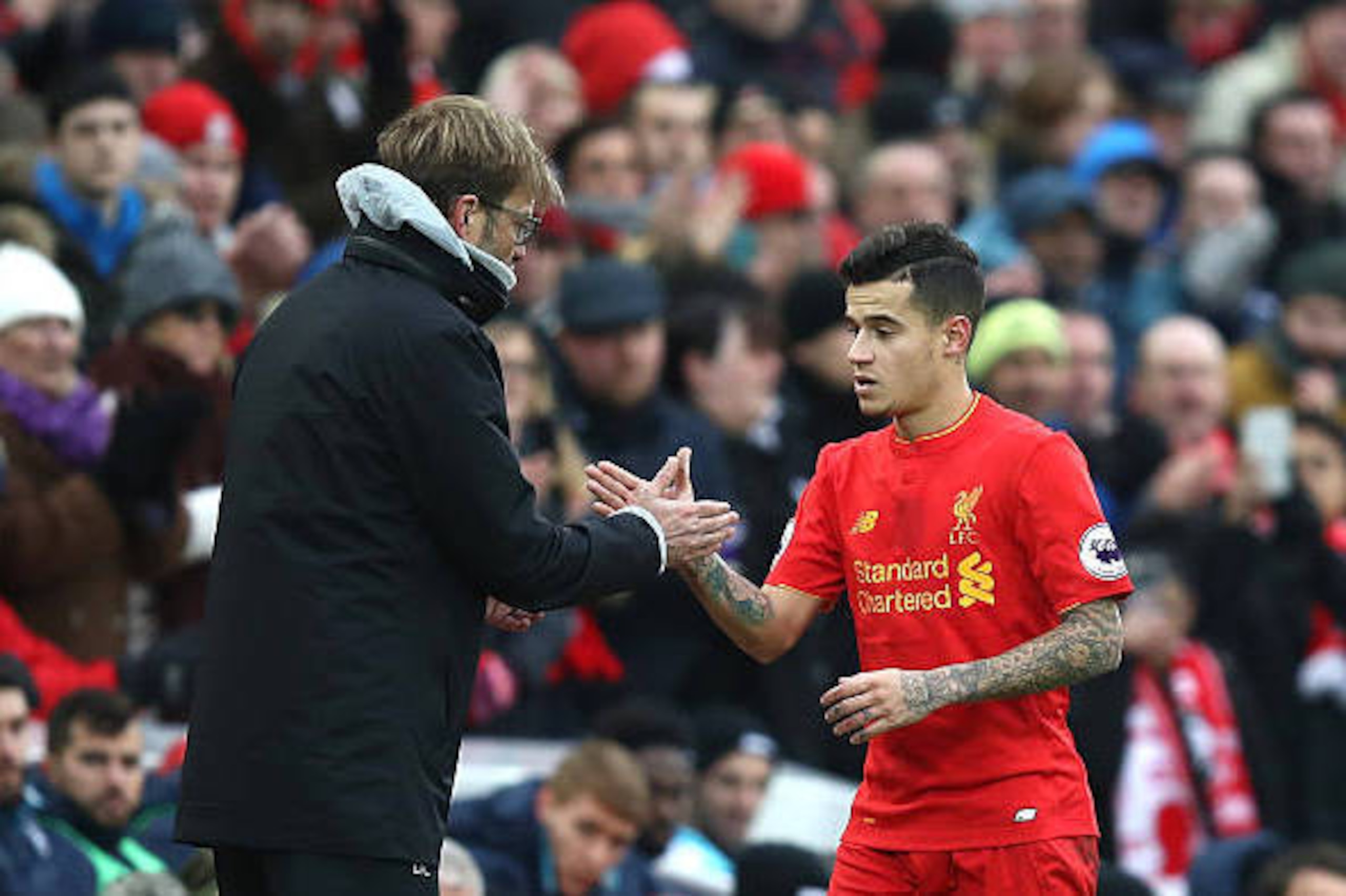 LIVERPOOL, ENGLAND - JANUARY 21: Jurgen Klopp, Manager of Liverpool (L) and Philippe Coutinho of Liverpool (R) shake hands after he is subbed off during the Premier League match between Liverpool and Swansea City at Anfield on January 21, 2017 in Liverpoo LIVERPOOL, ENGLAND - JANUARY 21: Jurgen Klopp, Manager of Liverpool (L) and Philippe Coutinho of Liverpool (R) shake hands after he is subbed off during the Premier League match between Liverpool and Swansea City at Anfield on January 21, 2017 in Liverpoo