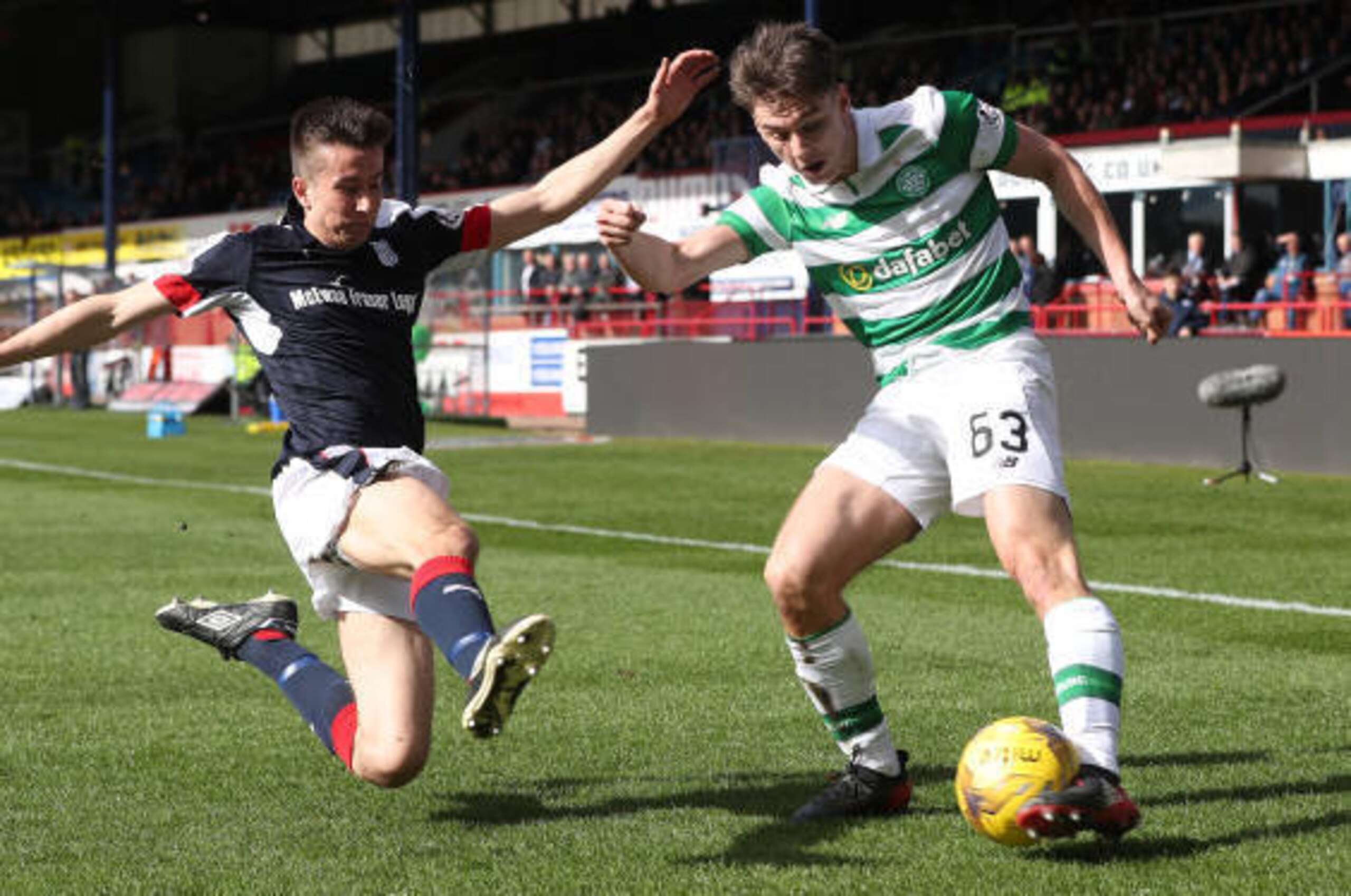 DUNDEE, SCOTLAND - MARCH 19: Cameron Kerr of Dundee vies with Kieran Tierney of Celtic during the Ladbrokes Scottish Premiership match between Dundee and Celtic at Dens Park Stadium on March 19, 2017 in Dundee, Scotland. (Photo by Ian MacNicol/Getty Imag DUNDEE, SCOTLAND - MARCH 19: Cameron Kerr of Dundee vies with Kieran Tierney of Celtic during the Ladbrokes Scottish Premiership match between Dundee and Celtic at Dens Park Stadium on March 19, 2017 in Dundee, Scotland. (Photo by Ian MacNicol/Getty Imag