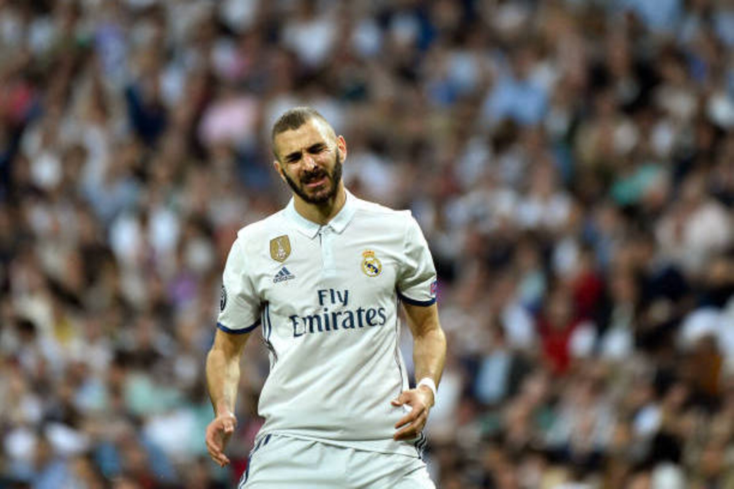 Real Madrid's French forward Karim Benzema gestures after missing a goal opportunity during the UEFA Champions League semi-final first leg football match Real Madrid vs Atletico de Madrid at the Santiago Bernabeu stadium in Madrid on May 2, 2017. Real Mad