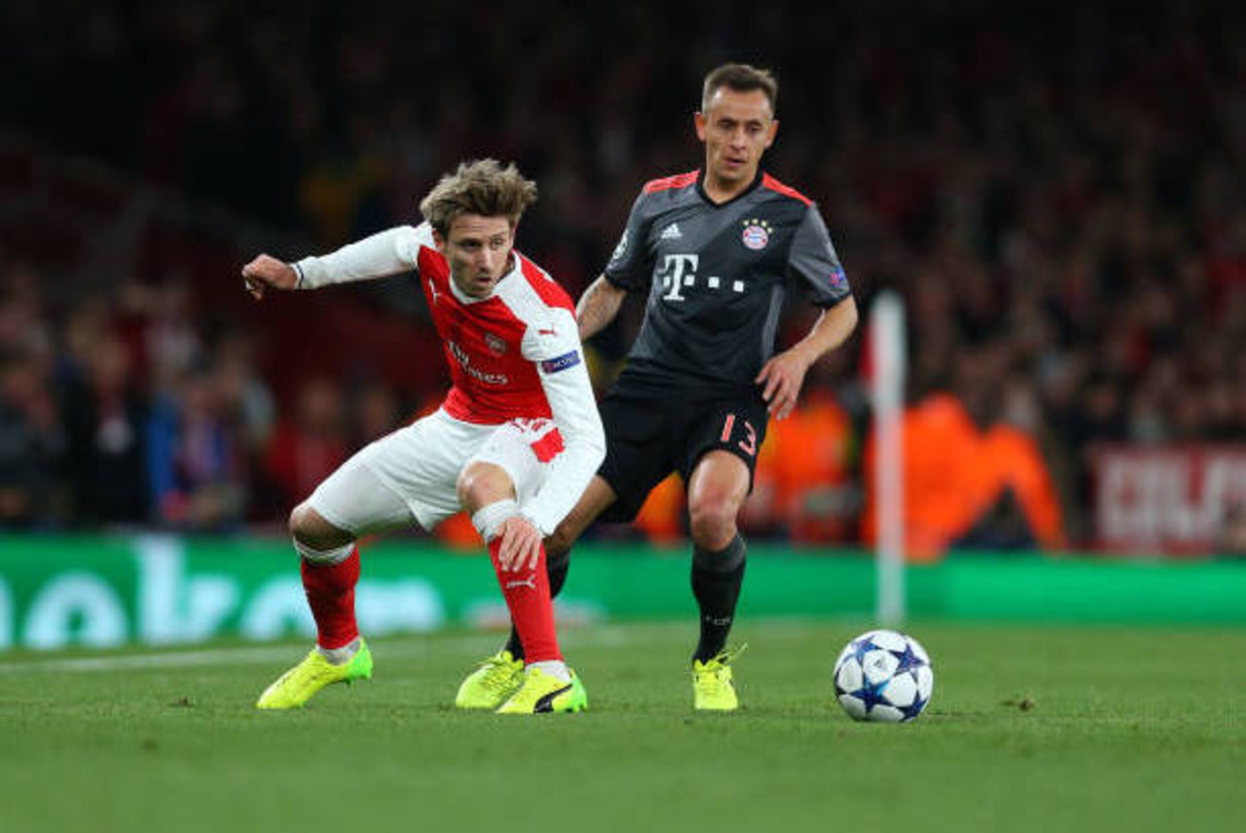 LONDON, ENGLAND - MARCH 07: Nacho Monreal of Arsenal and Rafinha of Bayern Munich during the UEFA Champions League Round of 16 second leg match between Arsenal FC and FC Bayern Muenchen at Emirates Stadium on March 7, 2017 in London, United Kingdom. (Phot