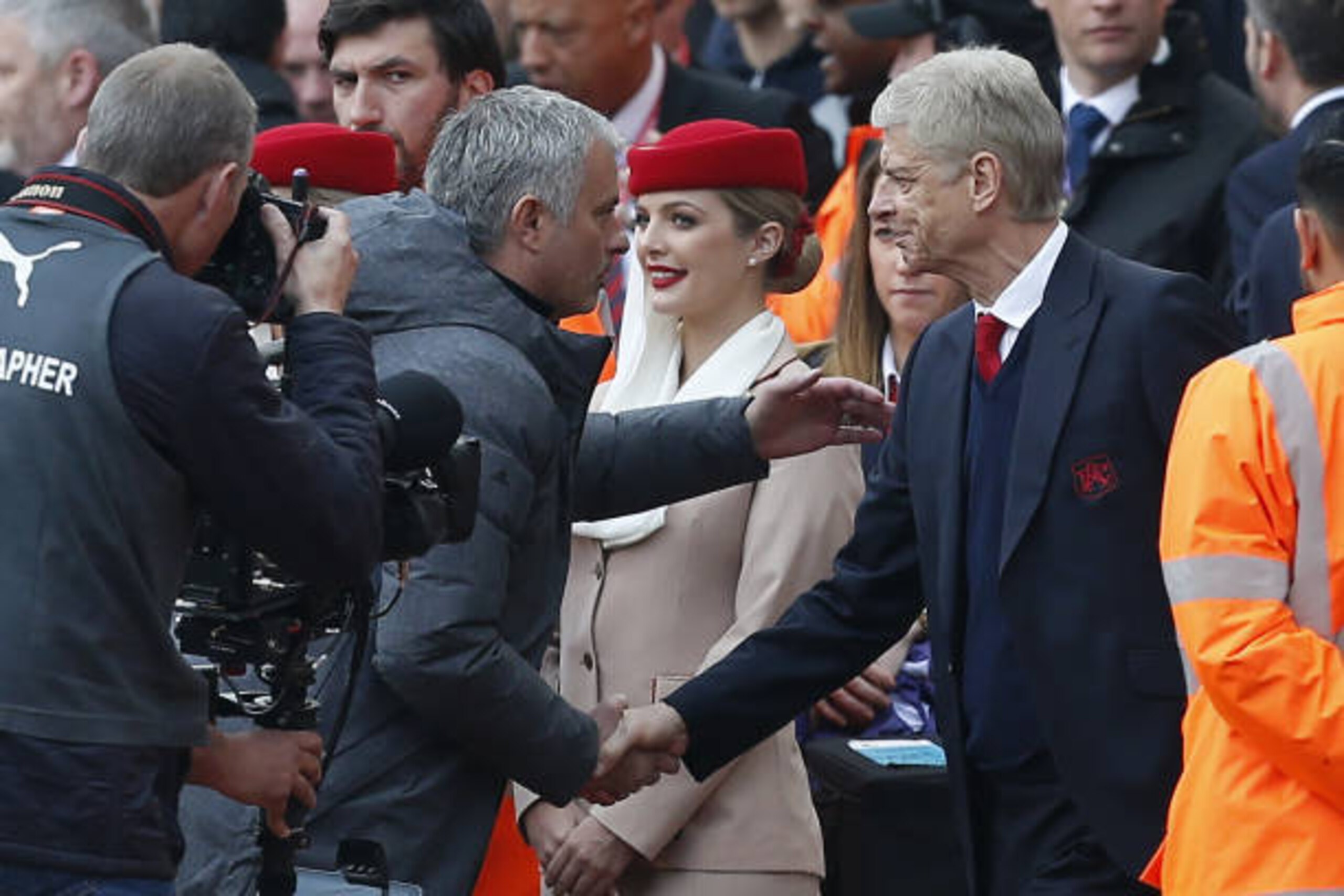 Arsenal's French manager Arsene Wenger (R) shakes hands with Manchester United's Portuguese manager Jose Mourinho ahead of the English Premier League football match between Arsenal and Manchester United at the Emirates Stadium in London on May 7, 2017.  /