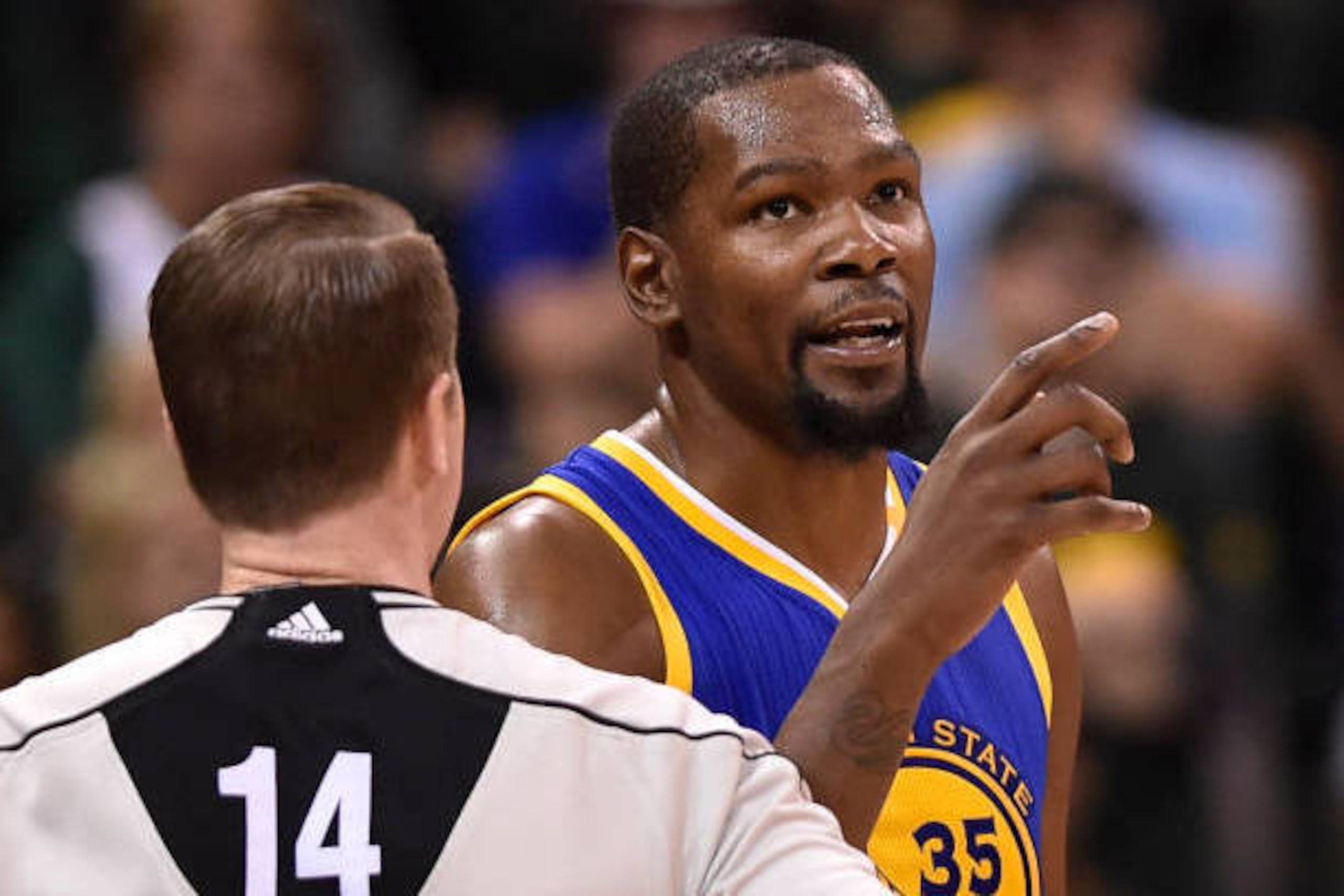 SALT LAKE CITY, UT - MAY 6: Kevin Durant #35 of the Golden State Warriors speaks with official Ed Malloy after he was assessed a technical foul and a flagrant foul during the second half of their 102-91 win over the Utah Jazz in Game Three of the Western 