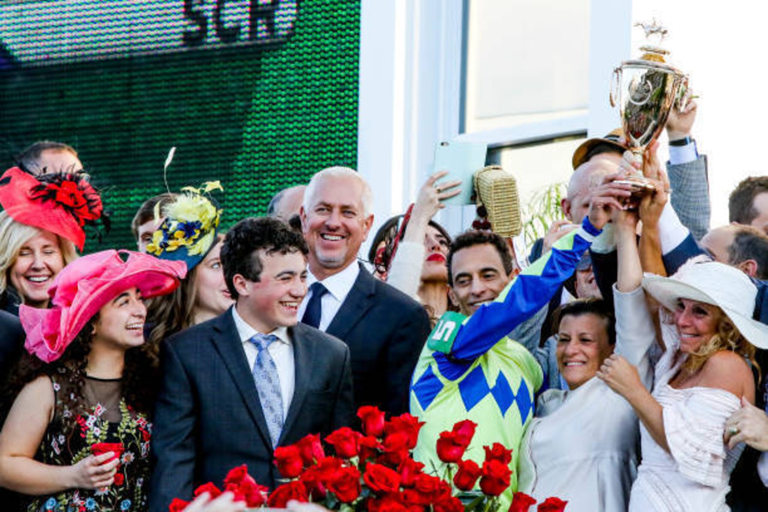 LOUISVILLE, KY - MAY 06: Connections hold up the winner's trophy after  Always Dreaming #5 won the Kentucky Derby on Kentucky Derby Day at Churchill Downs on May 6, 2017 in Louisville, Kentucky. (Photo by Candice Chavez/Eclipse Sportswire/Getty Images)