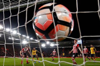 SOUTHAMPTON, ENGLAND - JANUARY 28: Theo Walcott of Arsenal scores his sides third goal during the Emirates FA Cup Fourth Round match between Southampton and Arsenal at St Mary's Stadium on January 28, 2017 in Southampton, England.  (Photo by Julian Finney