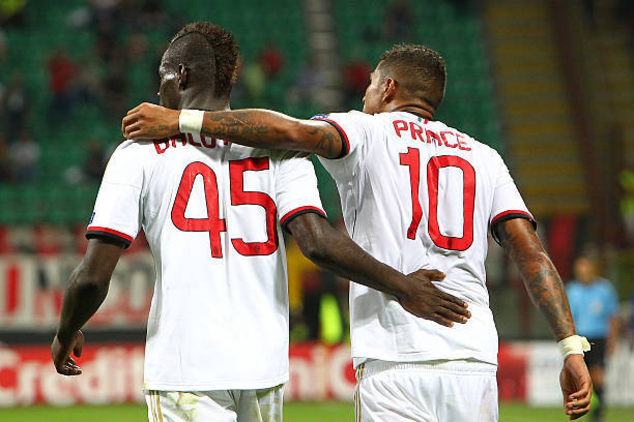 MILAN, ITALY - AUGUST 28:  Kevin-Prince Boateng (R) of AC Milan celebrates his second goal with team-mate Mario Balotelli (L) during the UEFA Champions League Play Off Second leg match between AC Milan and PSV Eindhoven at Stadio Giuseppe Meazza on August