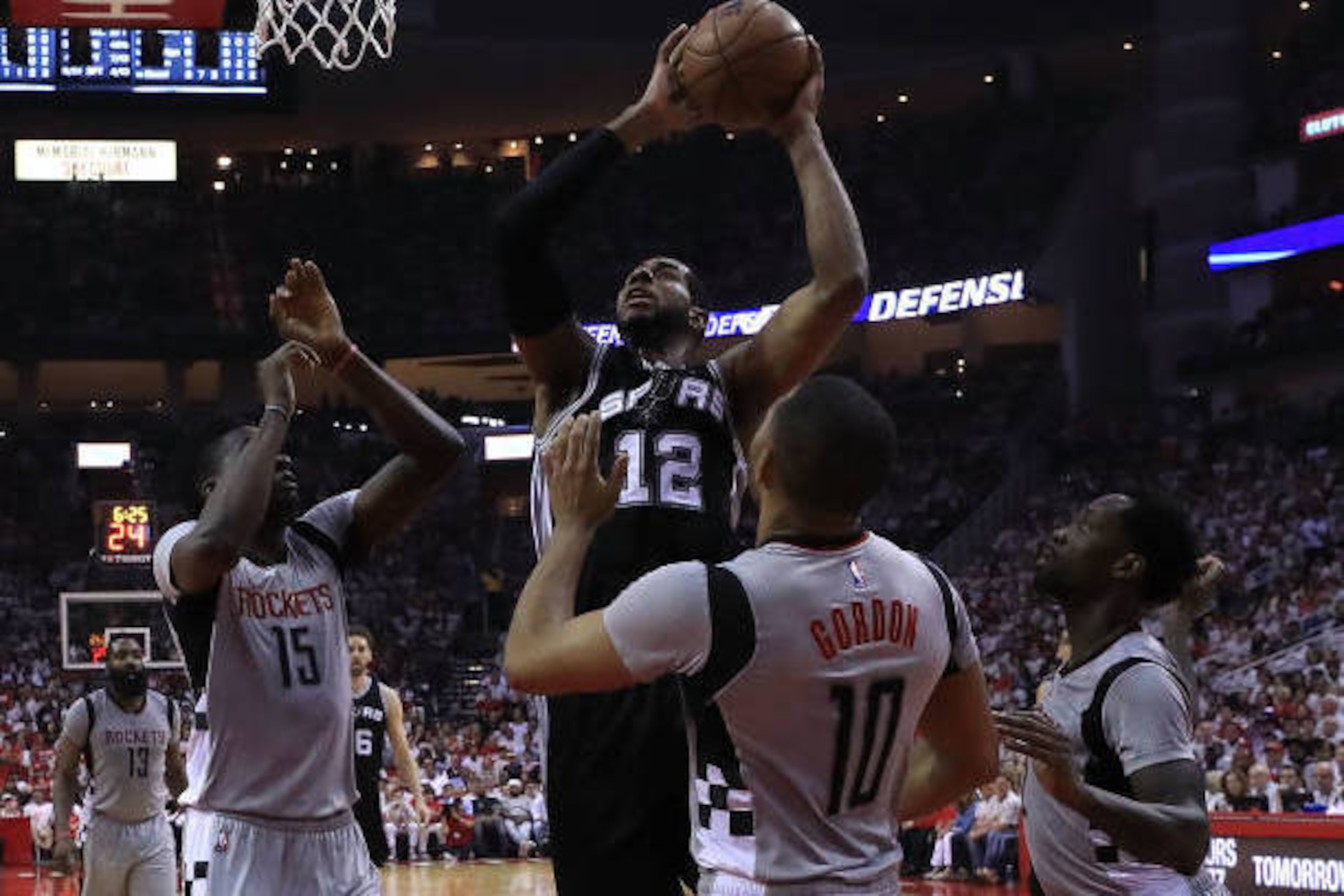HOUSTON, TX - MAY 07: LaMarcus Aldridge #12 of the San Antonio Spurs shoots against Clint Capela #15, Eric Gordon #10 and Patrick Beverley #2 of the Houston Rockets during Game Three of the NBA Western Conference Semi-Finals at Toyota Center on May 7, 20 HOUSTON, TX - MAY 07: LaMarcus Aldridge #12 of the San Antonio Spurs shoots against Clint Capela #15, Eric Gordon #10 and Patrick Beverley #2 of the Houston Rockets during Game Three of the NBA Western Conference Semi-Finals at Toyota Center on May 7, 20