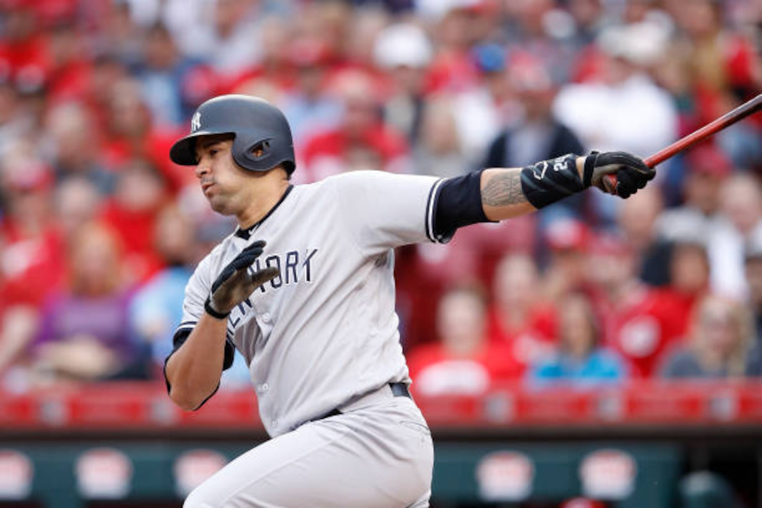 CINCINNATI, OH - MAY 08: Gary Sanchez #24 of the New York Yankees singles to left to drive in two runs against the Cincinnati Reds in the first inning of a game at Great American Ball Park on May 8, 2017 in Cincinnati, Ohio. (Photo by Joe Robbins/Getty Im